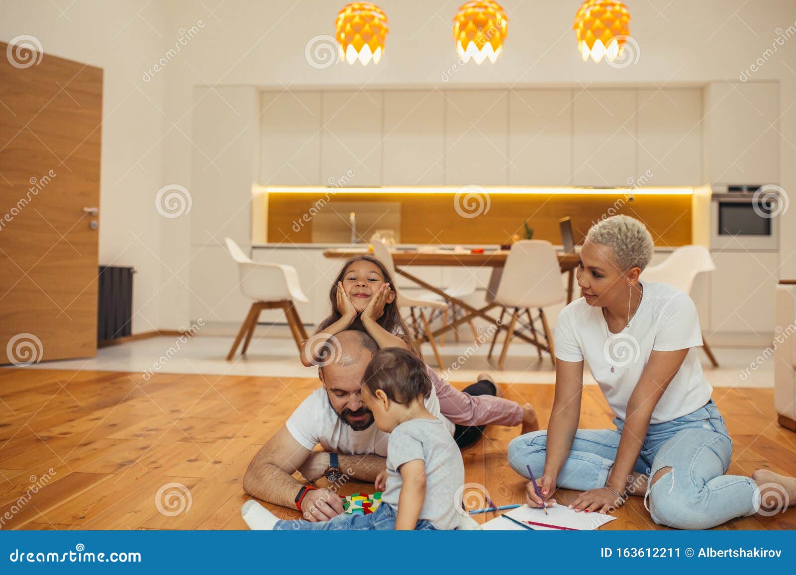 Caucasian Family Parents With Children Playing And Laughing On