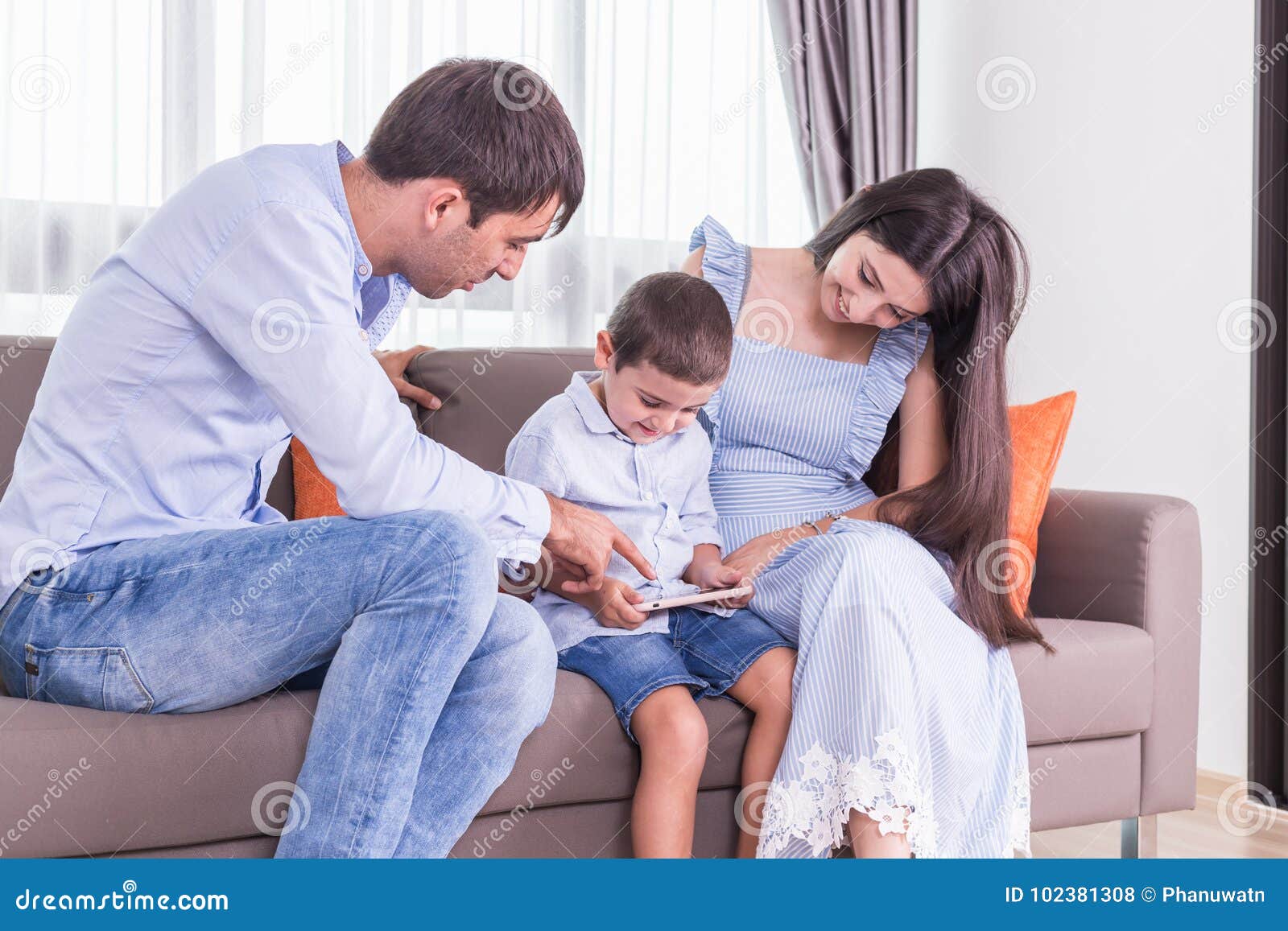 Caucasian Family in Status of Serious. Father and Mother Looking ...