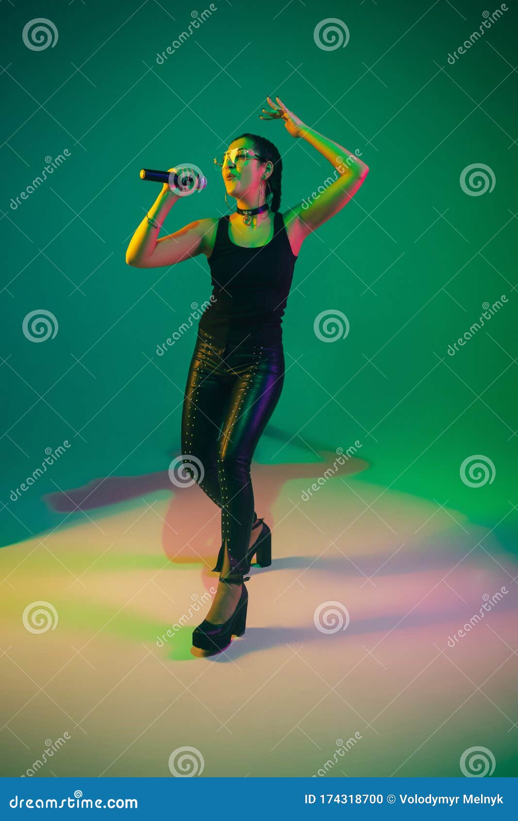 Caucasian Female Singer Portrait on Green Studio Background in Neon ...