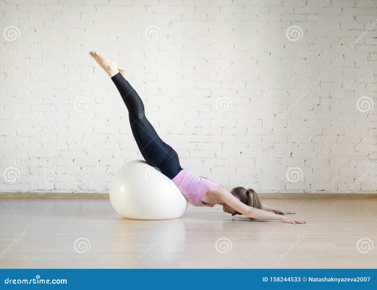 Blokkeren alleen bak Caucasian Girl Practice Pilates with Big Fit Ball in Fitness Studio, Upside  Down Pose, Selective Focus. Stock Image - Image of sport, studio: 158244533
