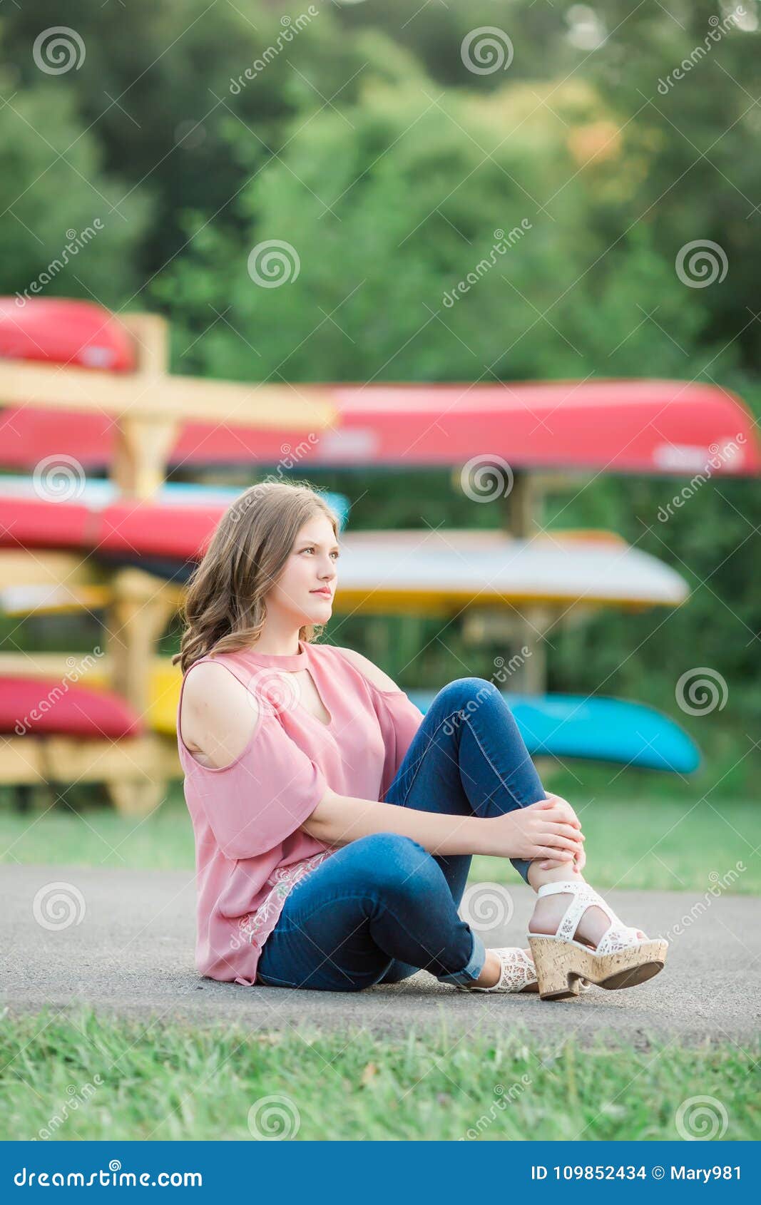 Caucasian High School Senior Girl Outside Sitting Stock Photo - Image ...