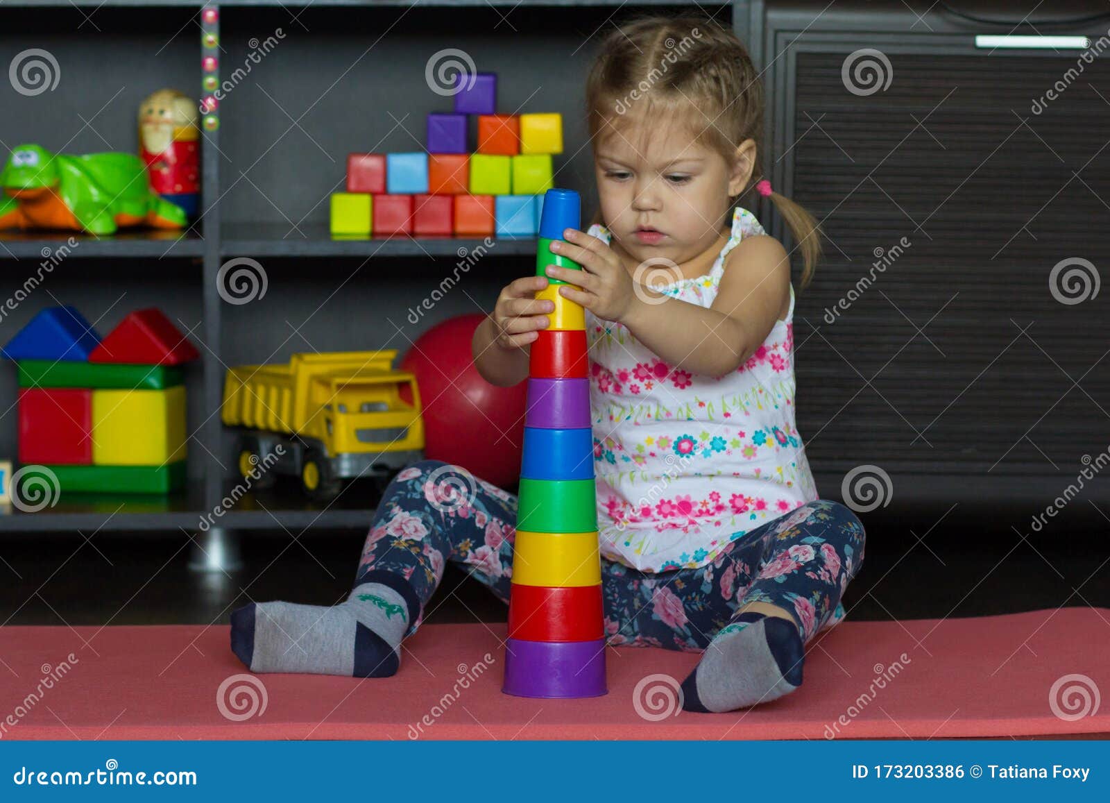 Caucasian Little Girl of Three Years Old Building Pyramid Using ...