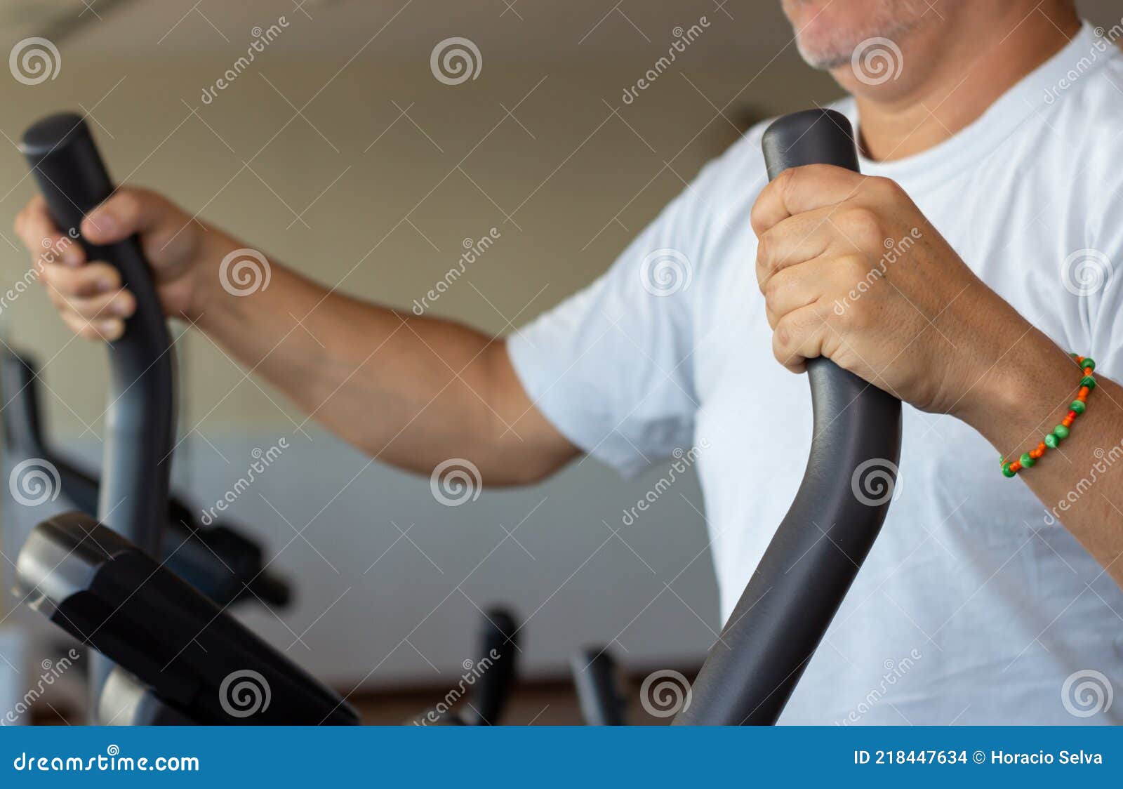 Caucasian Man In A Gym Doing Indoor Exercises Exercises In A Closed Caucasian Man In A Gym Doing Indoor Exercises Exercises In A Closed