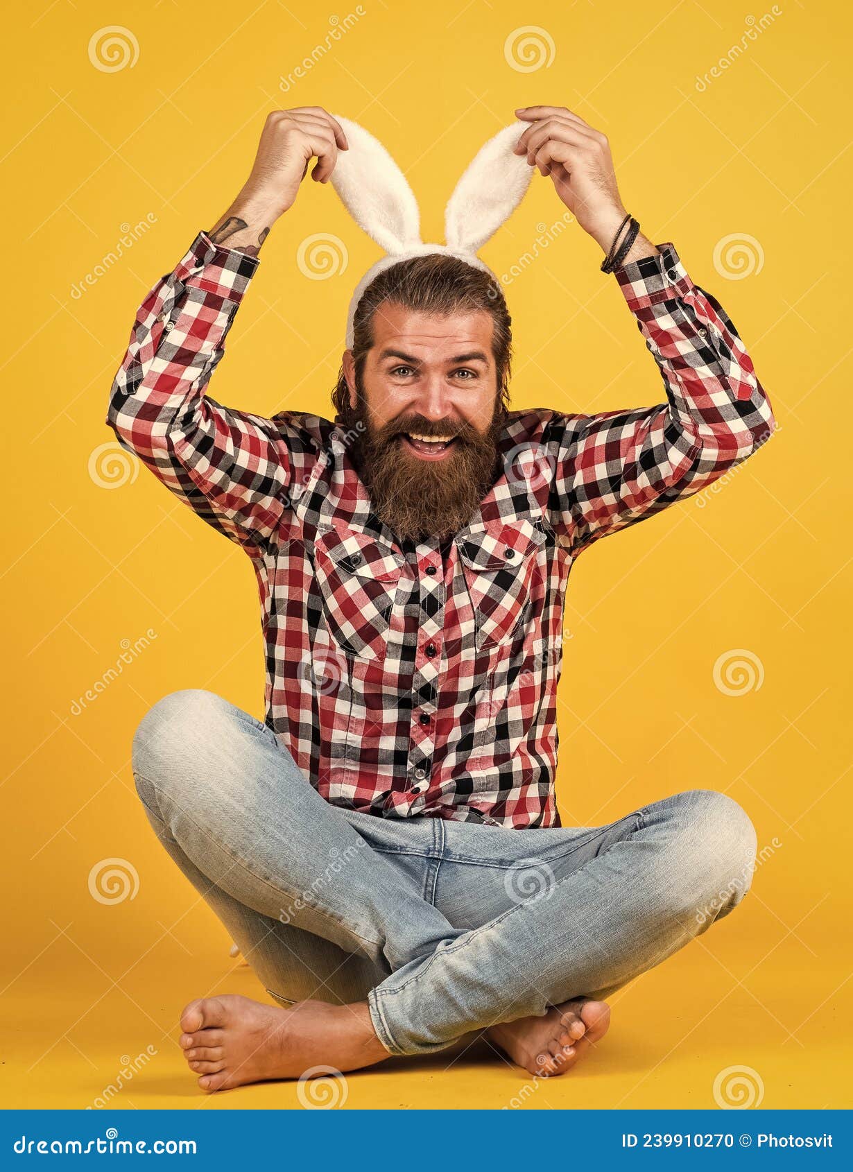 caucasian mature hipster in buny ears with trendy hairstyle in checkered shirt celebrate easter, easter fun