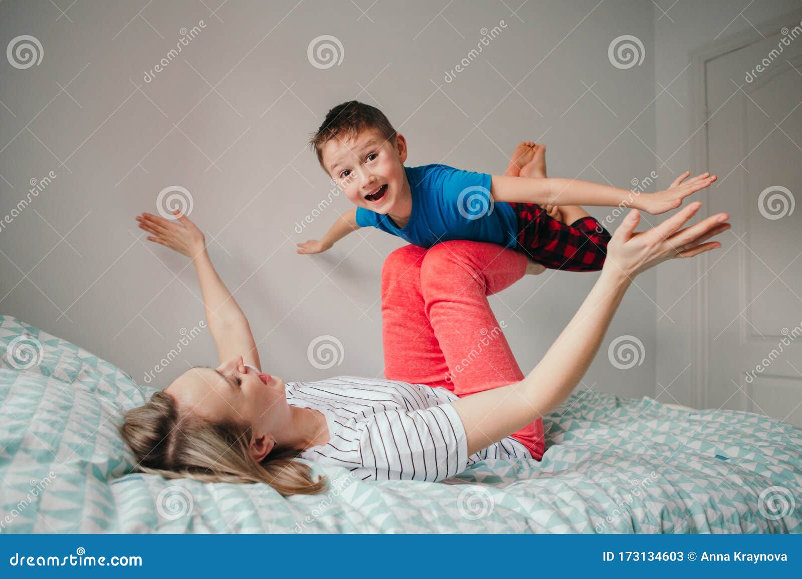 Caucasian Mother and Boy Son Playing in Bedroom at Home. Mom Rocking ...