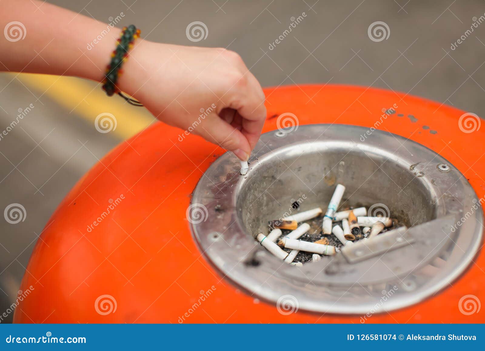 Caucasian Woman Hand Putting Out Cigarette on Street Ashtray, Ci Stock ...