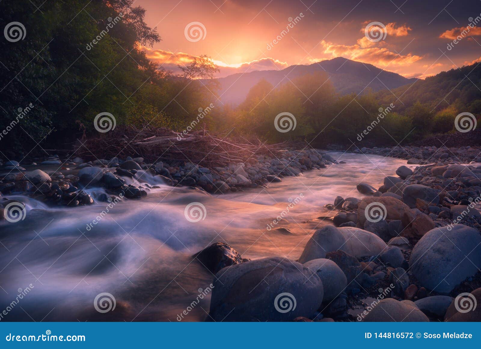 Beautiful Sunset Over Fast Flowing Mountain River Stock Photo Image