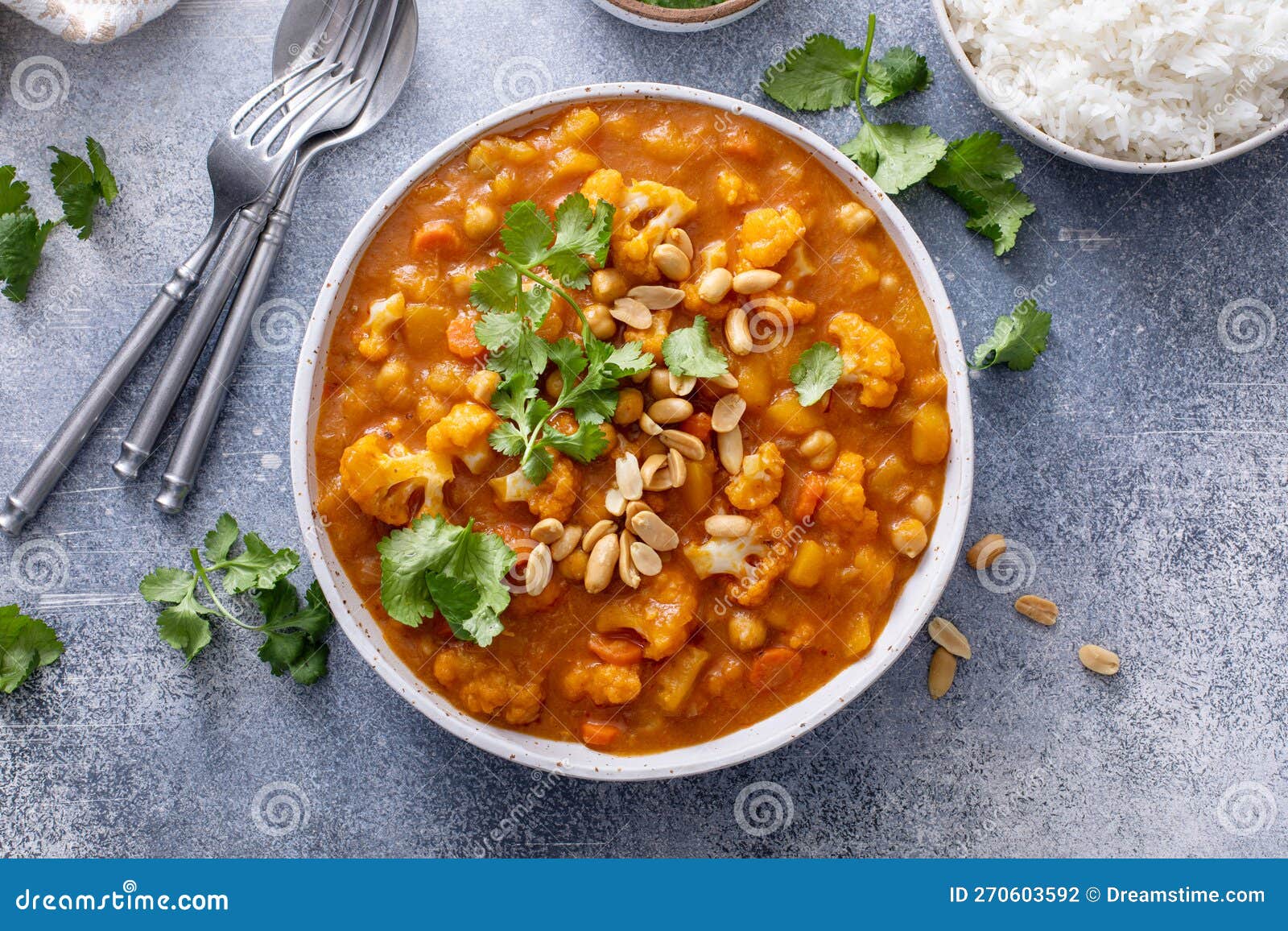 Cauliflower Curry with Peanuts and Cilantro in a Bowl Stock Photo