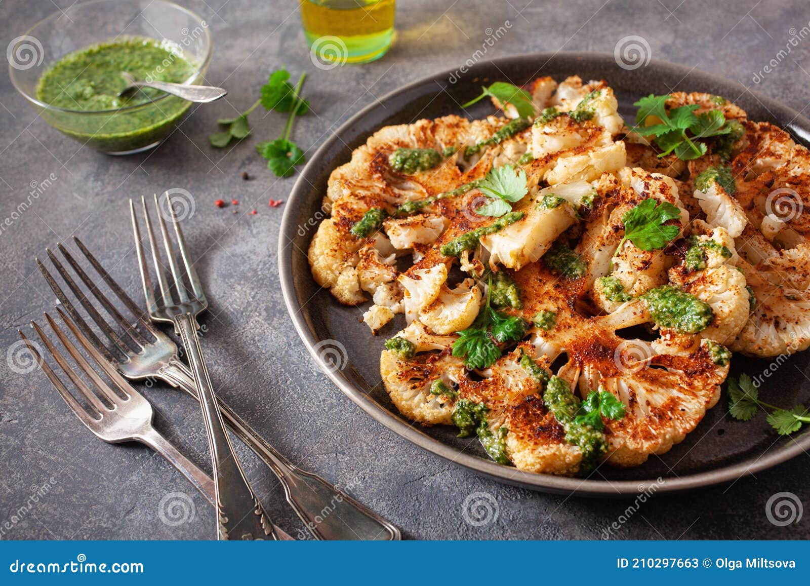 Cauliflower Steaks with Herb Sauce and Spice. Plant Based Meat