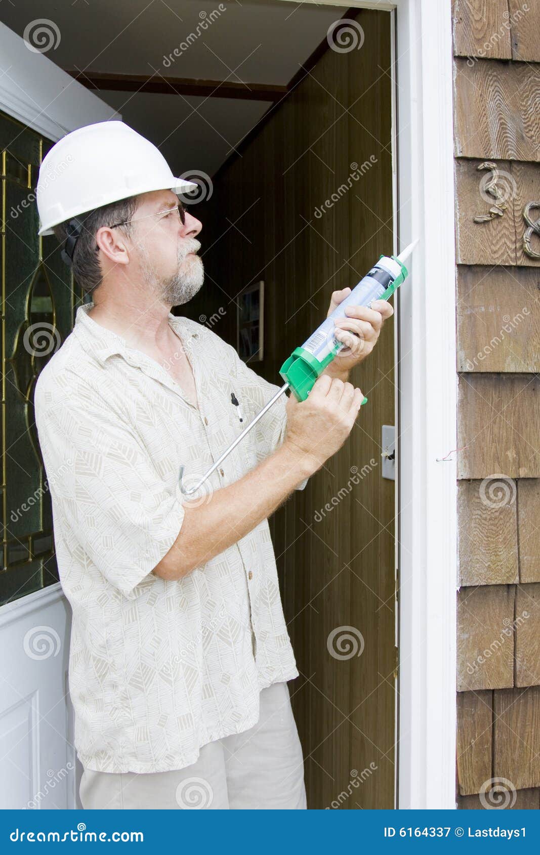 Caulking doors stock image. Image of remodel, green, weather 6164337