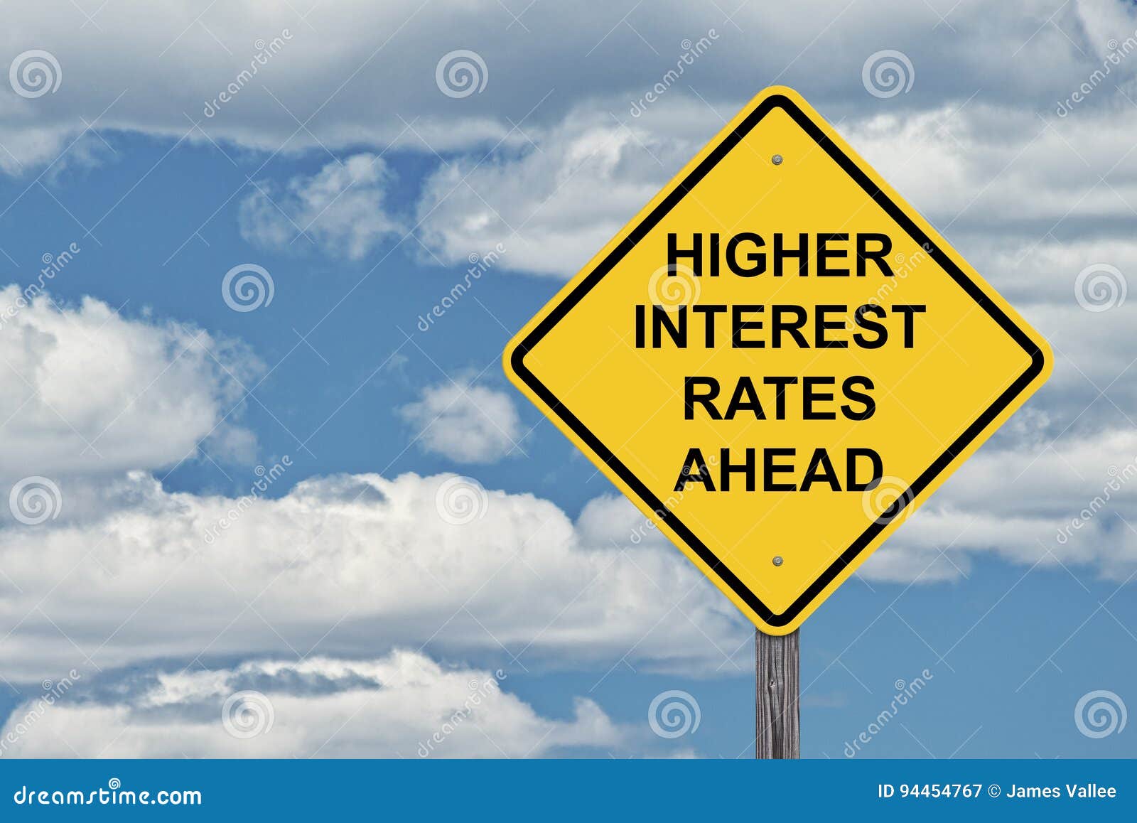 caution sign blue sky - higher interest rates