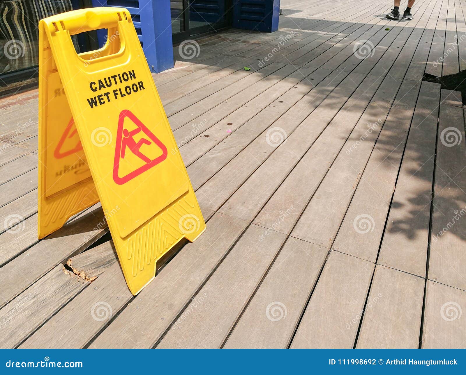 Caution Wet Floor Warning Sign with Blurred on the Wooden Floor Stock Photo Image of public