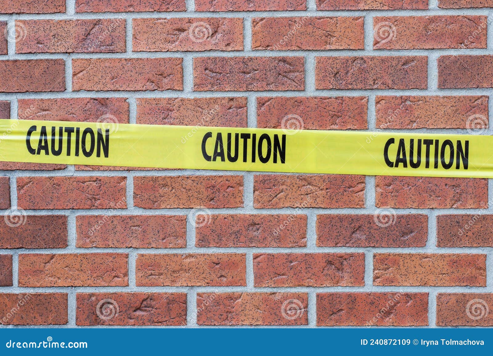 Caution Yellow Tape Against Brick Wall. Stock Image Image of