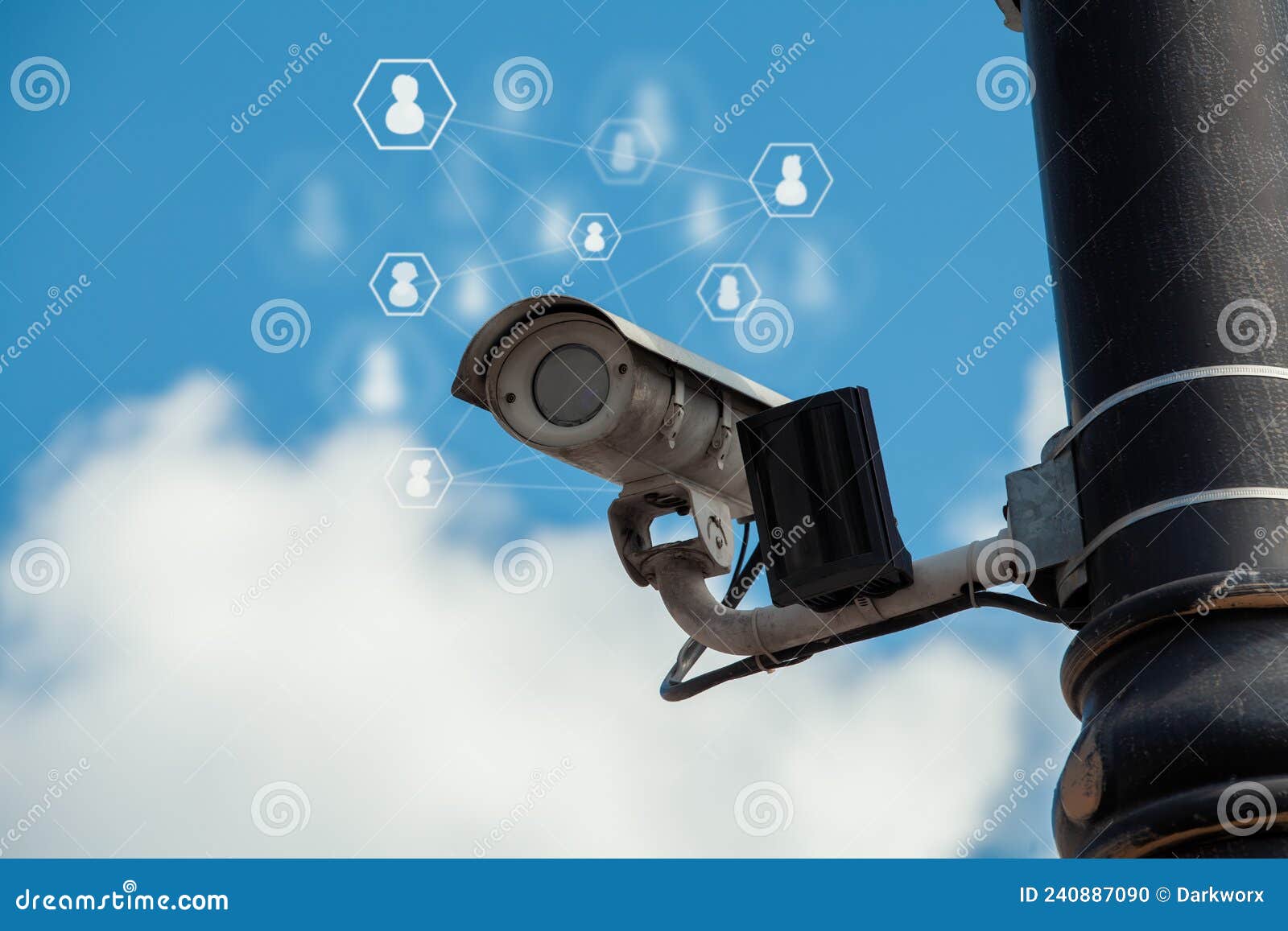 ccd surveillance camera mounted on a pole in the street