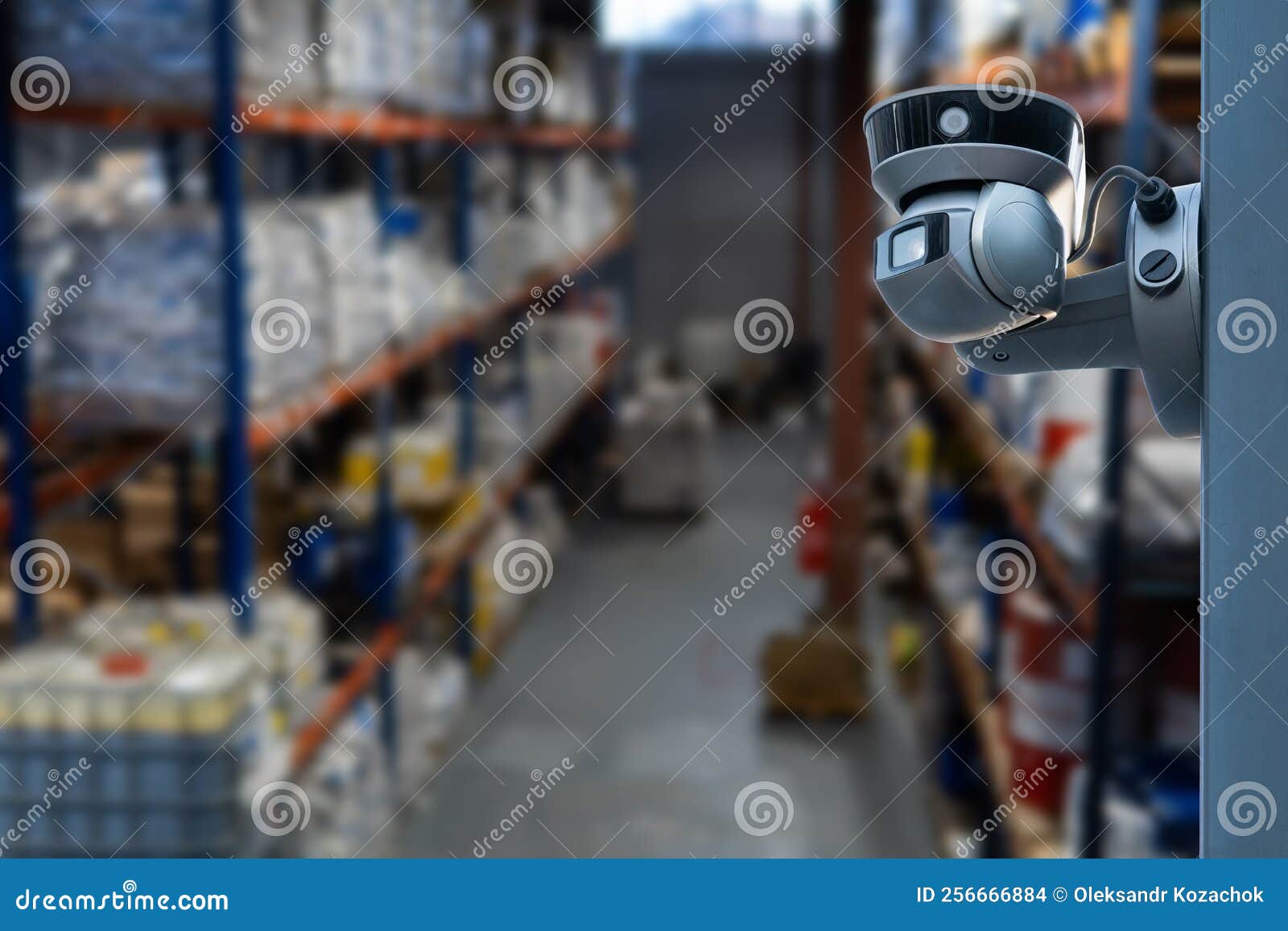 CCTV Camera Operating Inside Warehouse or Factory. Stock Photo Image