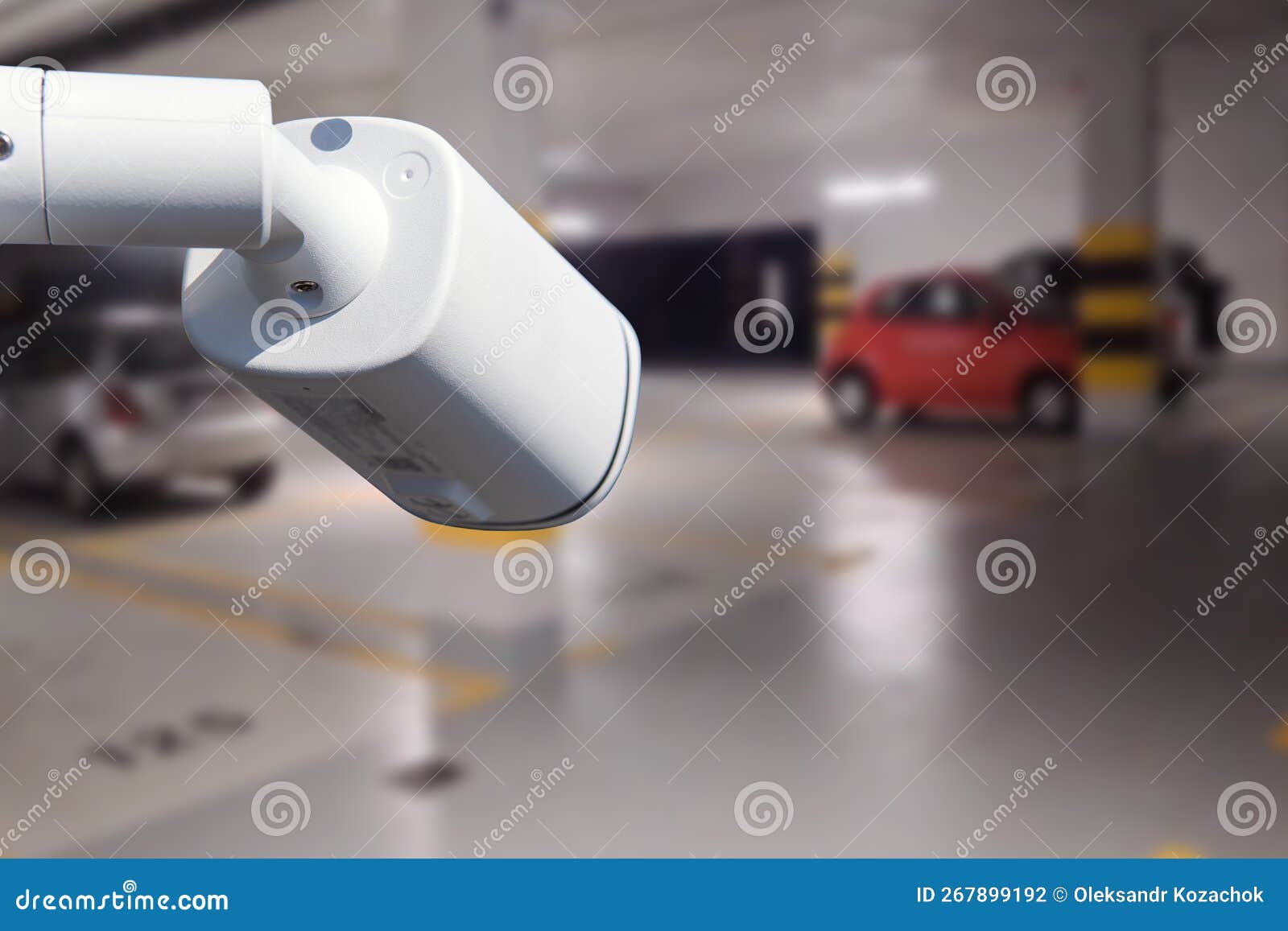 CCTV Camera in Underground Parking Garage. Copy Space. Stock Photo