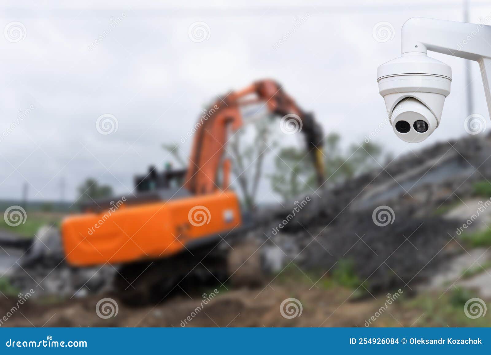 CCTV Camera Watching an Excavator and Workers Working on a Construction