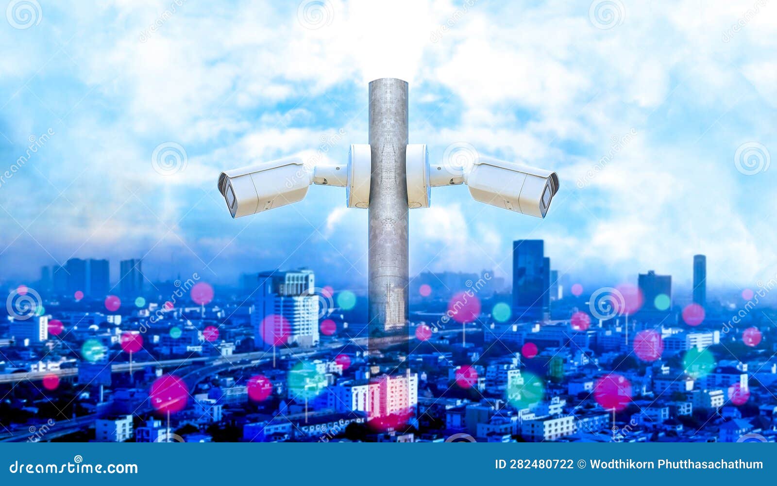CCTV Security Camera or Surveillance System with Cityscape and Blue Sky