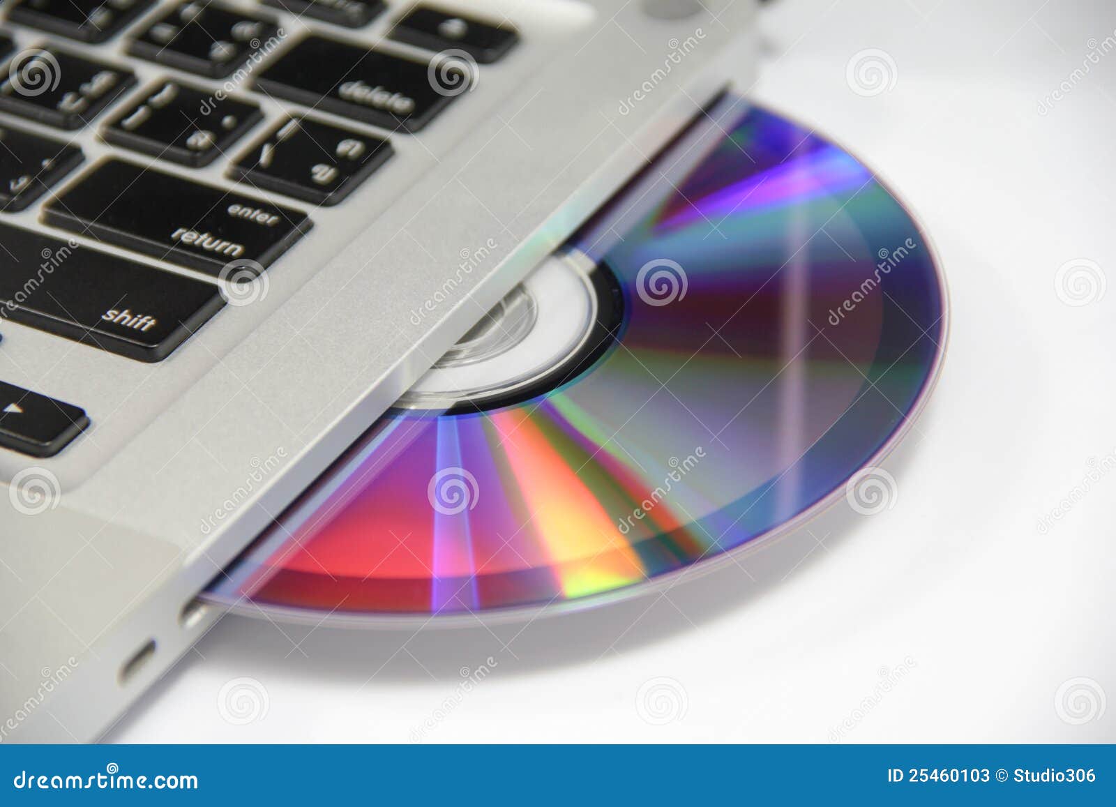Cd or dvd disk in laptop stock image. Image of disk, business 25460103