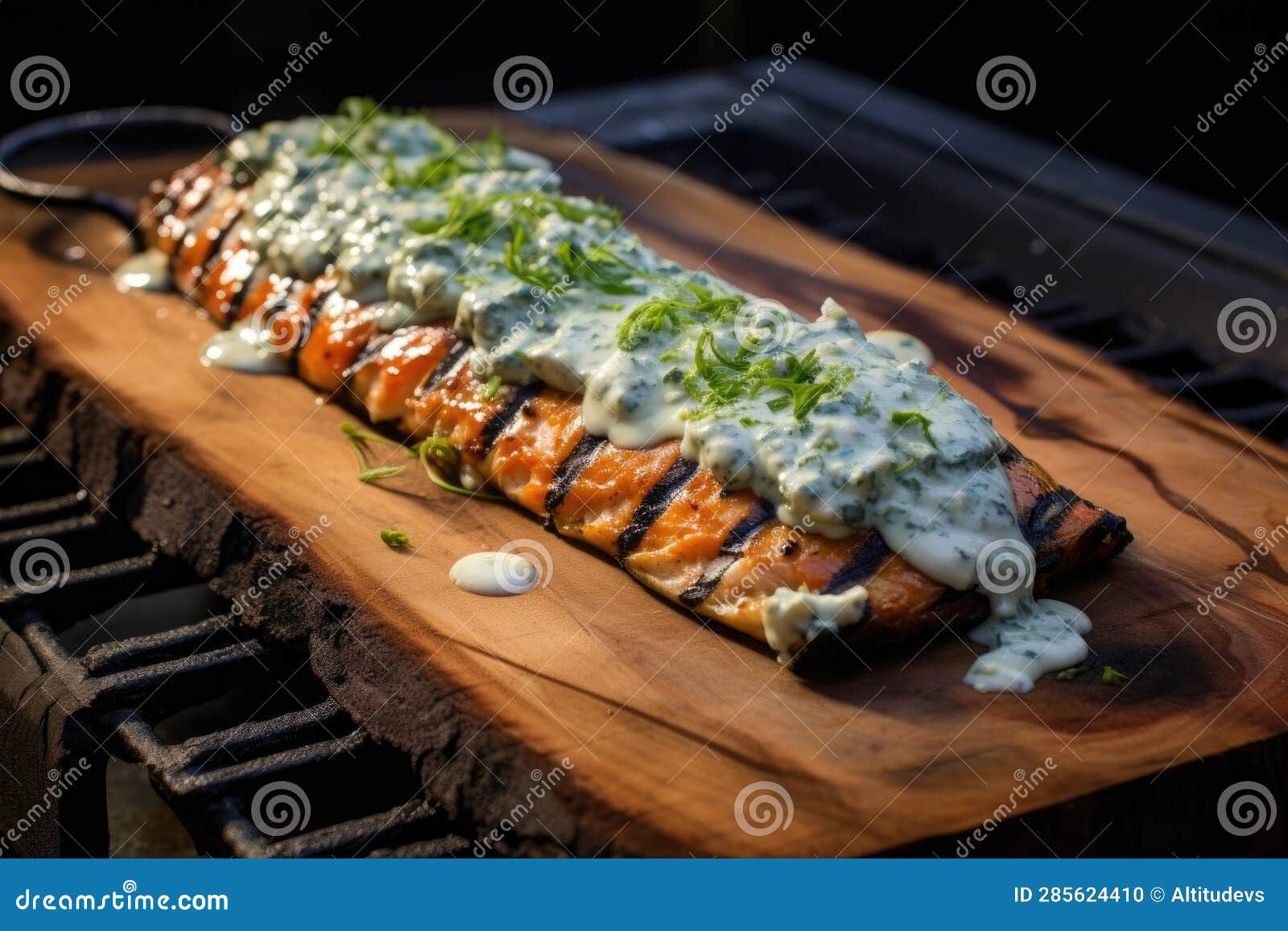 Cedar Plank on Grill with Melted Blue Cheese and Sauce Stock
