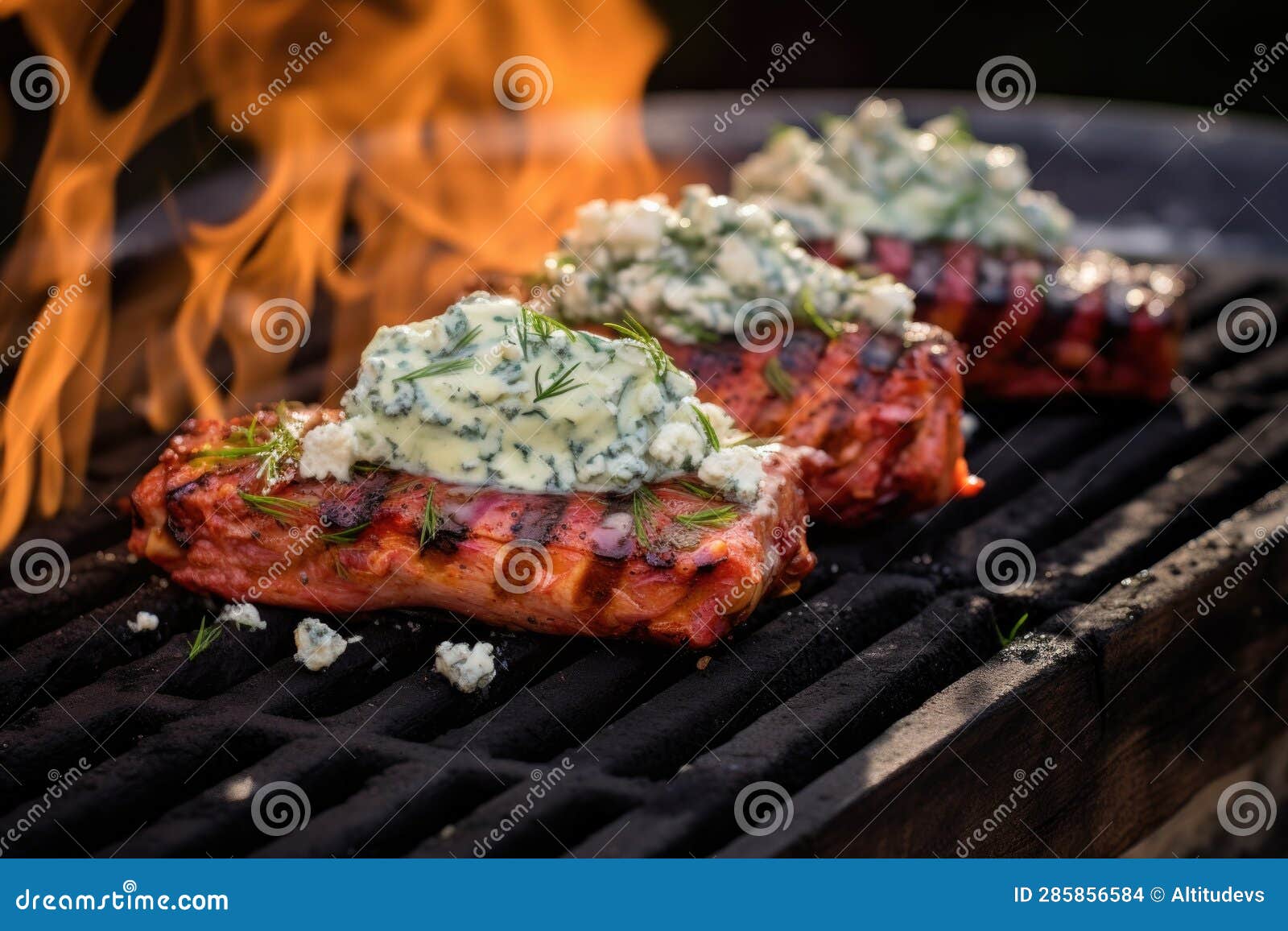Cedar Plank on Grill with Melted Blue Cheese and Sauce Stock Photo