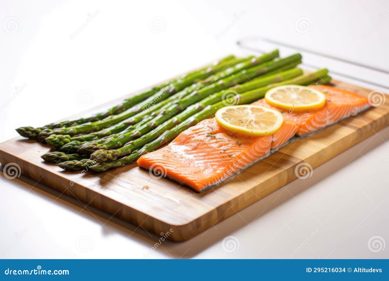 Cedar Plank Smoked Salmon with Asparagus on Serving Tray Stock Photo