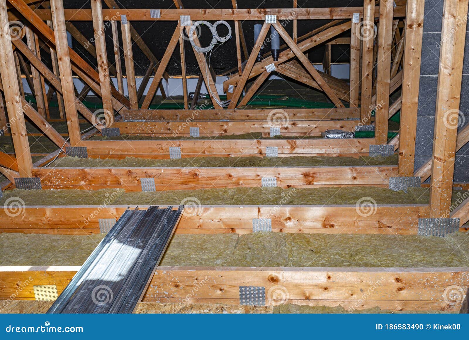 Ceiling and Attic Floor Insulation Made of Rock Wool between the