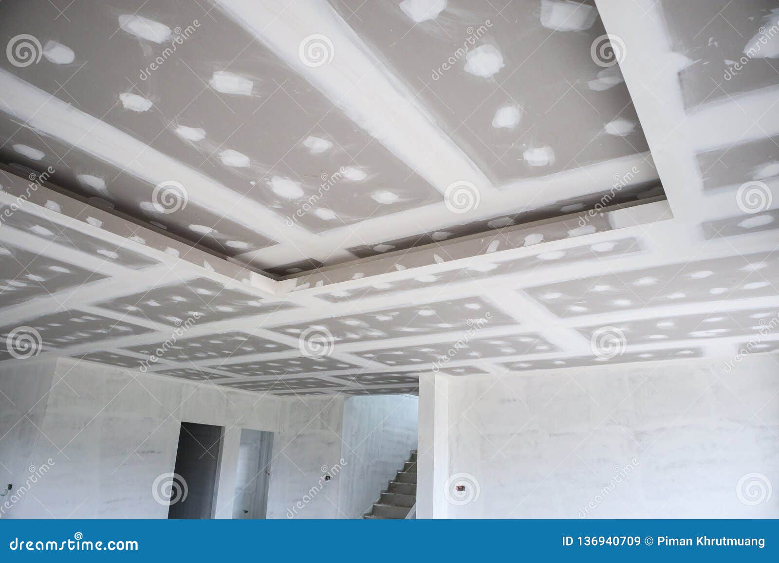 Ceiling Gypsum Board Installation At Construction Site Stock