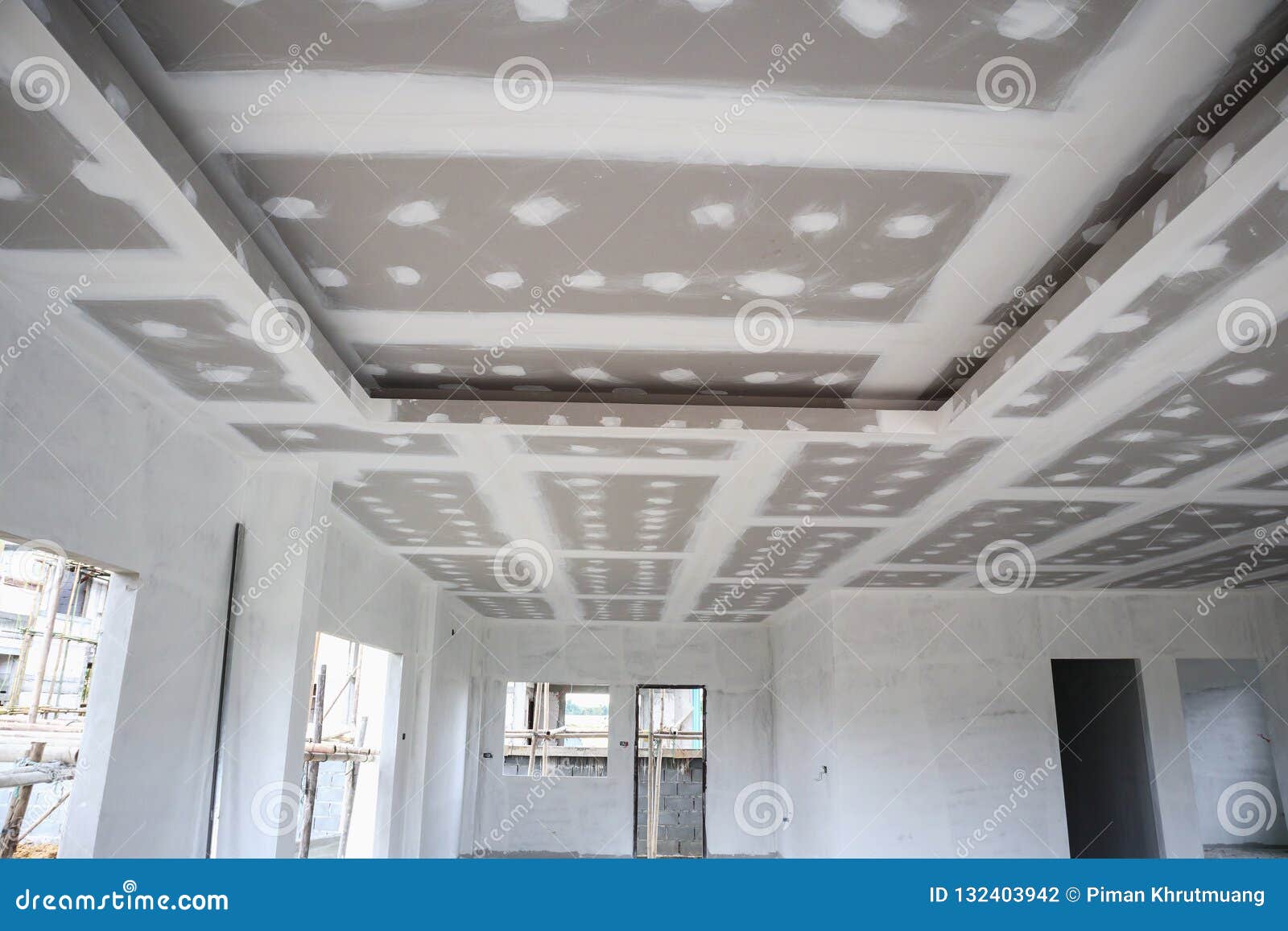 Ceiling Gypsum Board Installation At Construction Site Stock