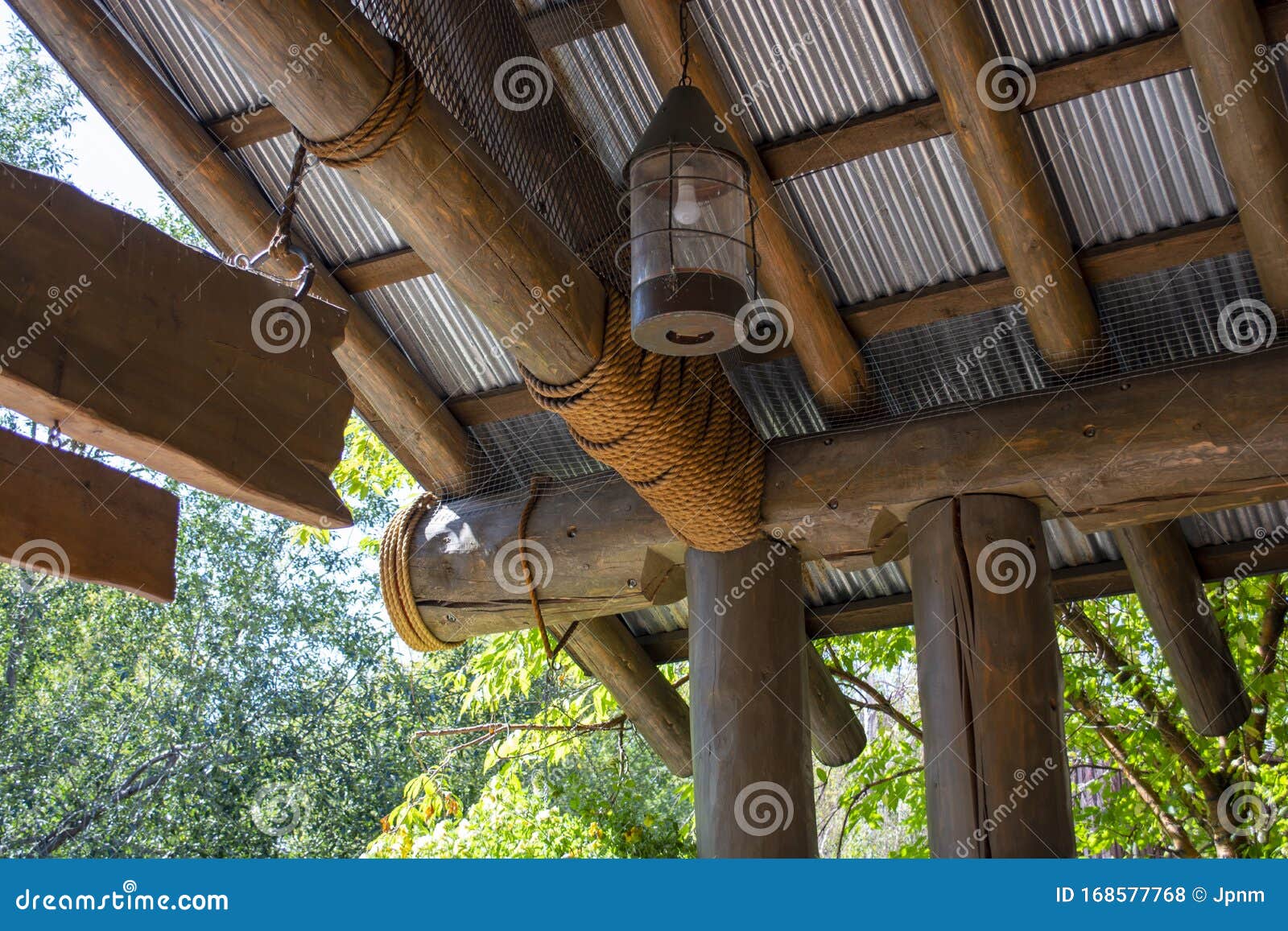 ceiling of jungle-themed hut constructed with logs and rope