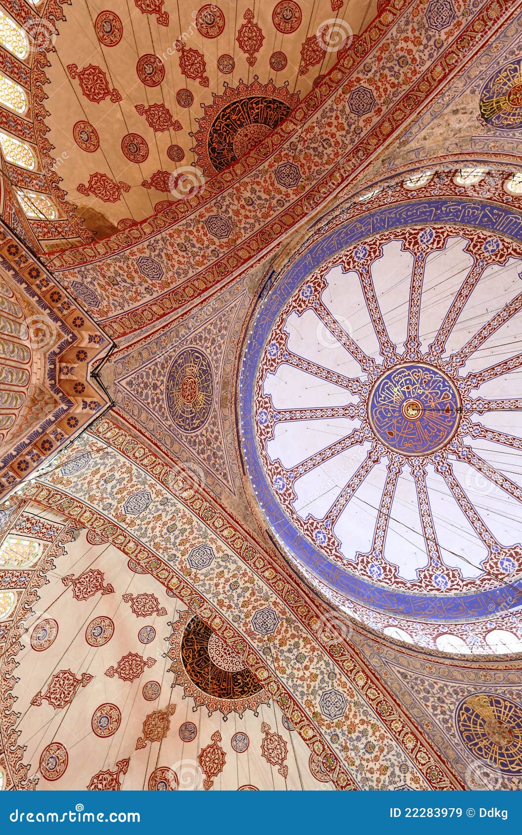 Ceilng at the Blue Mosque in Istanbul. The magnificent Ottoman era mosque ceiling showing the ornate floral pattern decorative features and islamic calligraphy