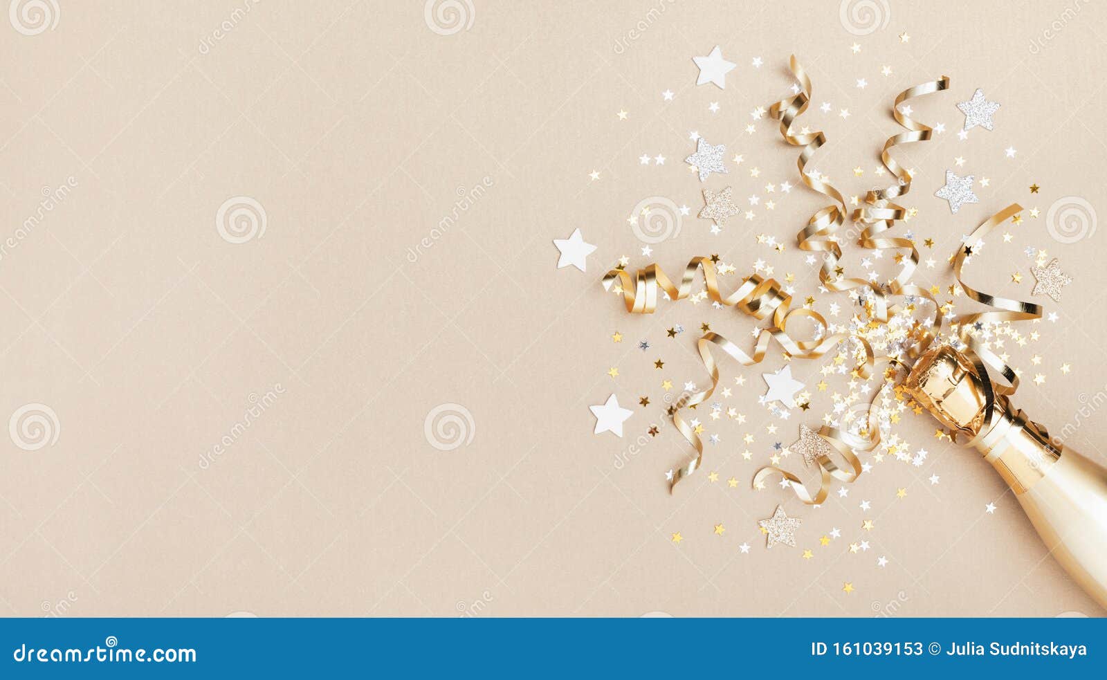 celebration background with golden champagne bottle, confetti stars and party streamers. christmas, birthday or wedding. flat lay