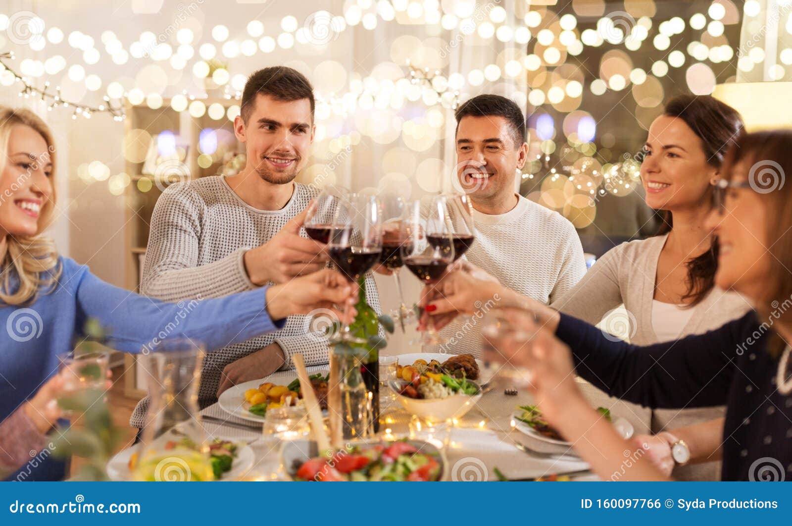 Happy Family Having Dinner Party at Home Stock Photo - Image of