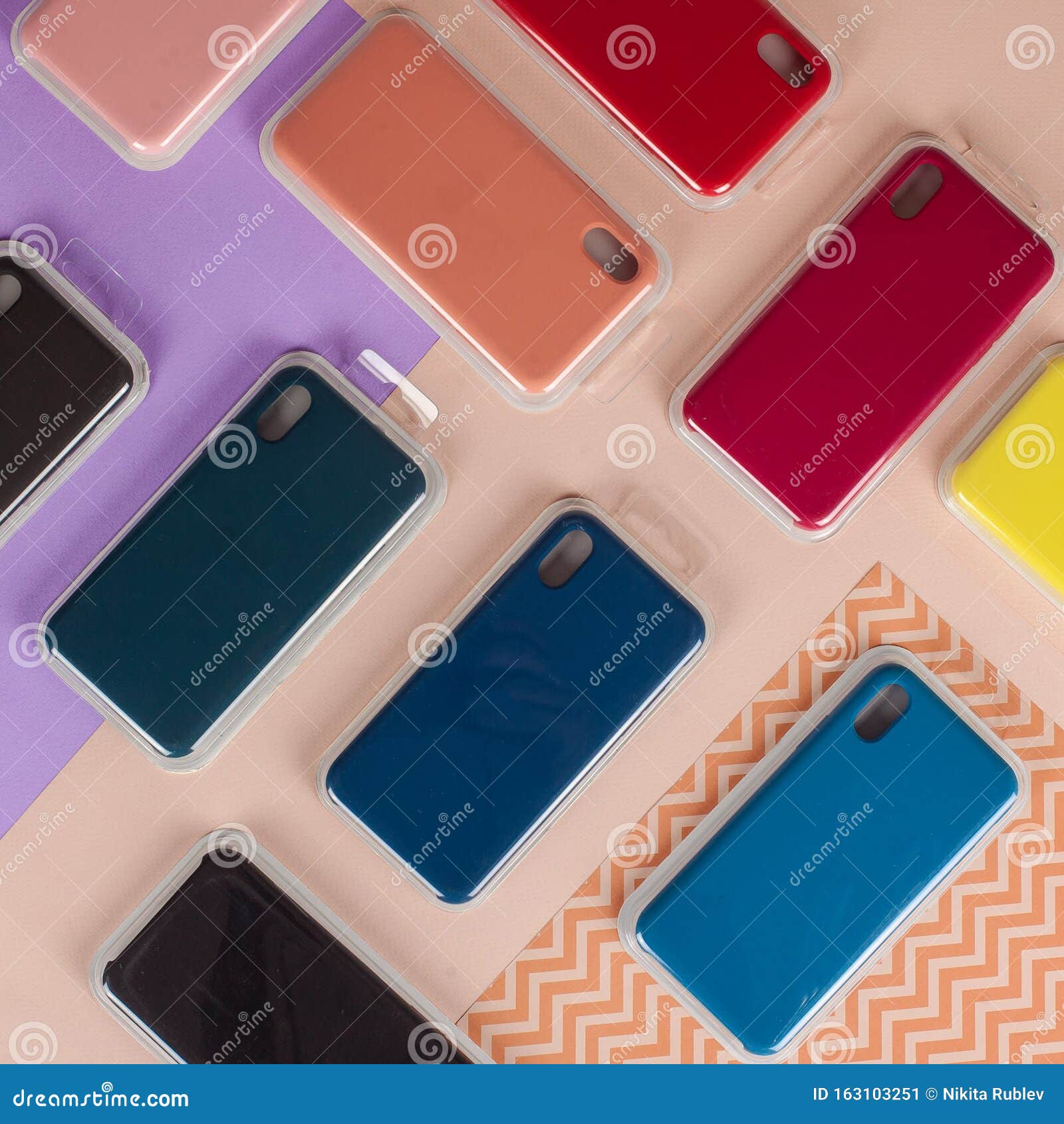 Cell Phone Cases Various Colors on Multicolor Paper Background Stock