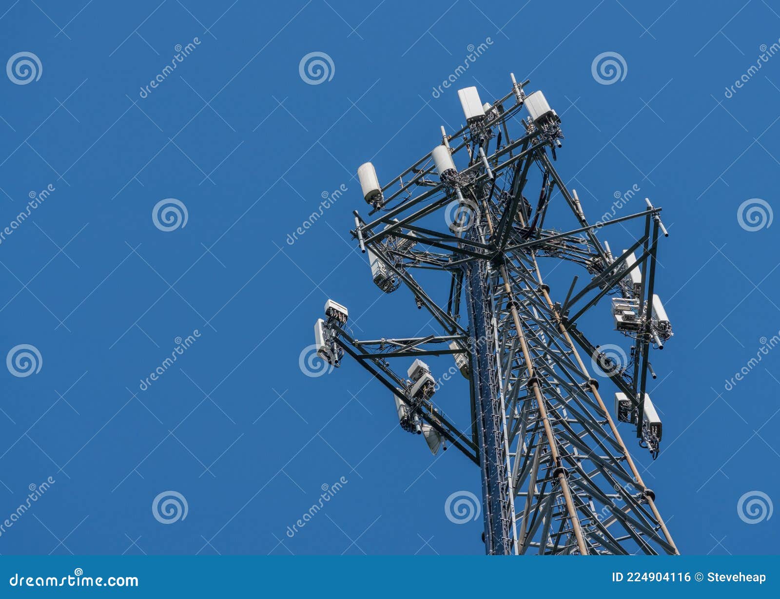 cell phone or mobile service tower providing broadband internet service against blue sky