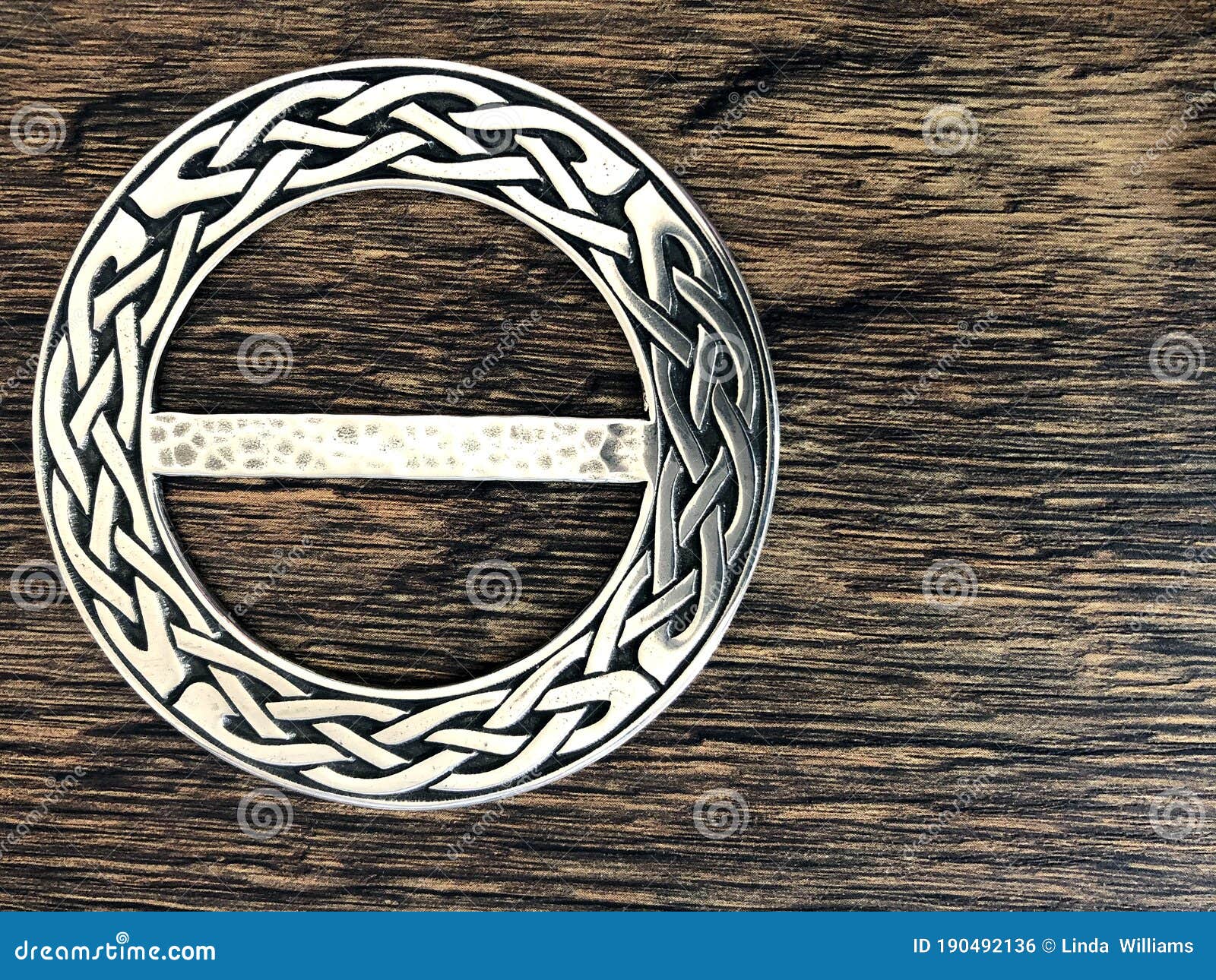 Celtic Knot Scarf Ring on Light Wood Stock Image - Image of plaid
