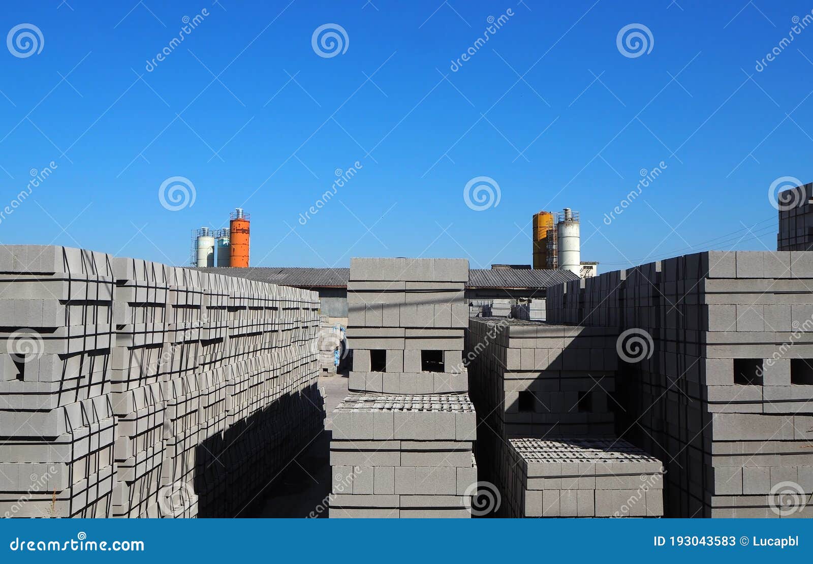 Cement Blocks Stacked Outside the Precast Concrete Factory. Stock Image