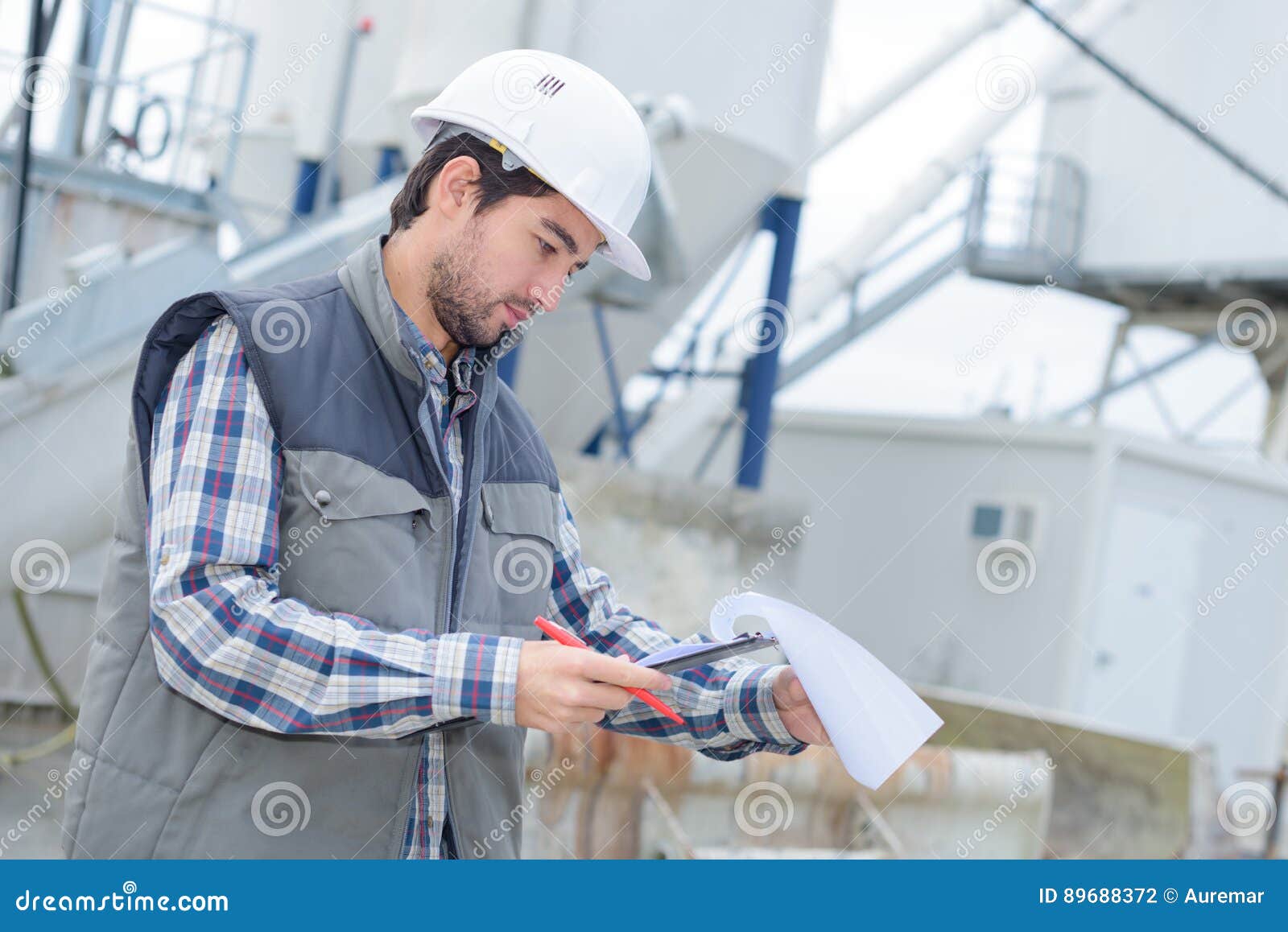 Cement Worker Inspecting Invoice Stock Photo Image of invoice