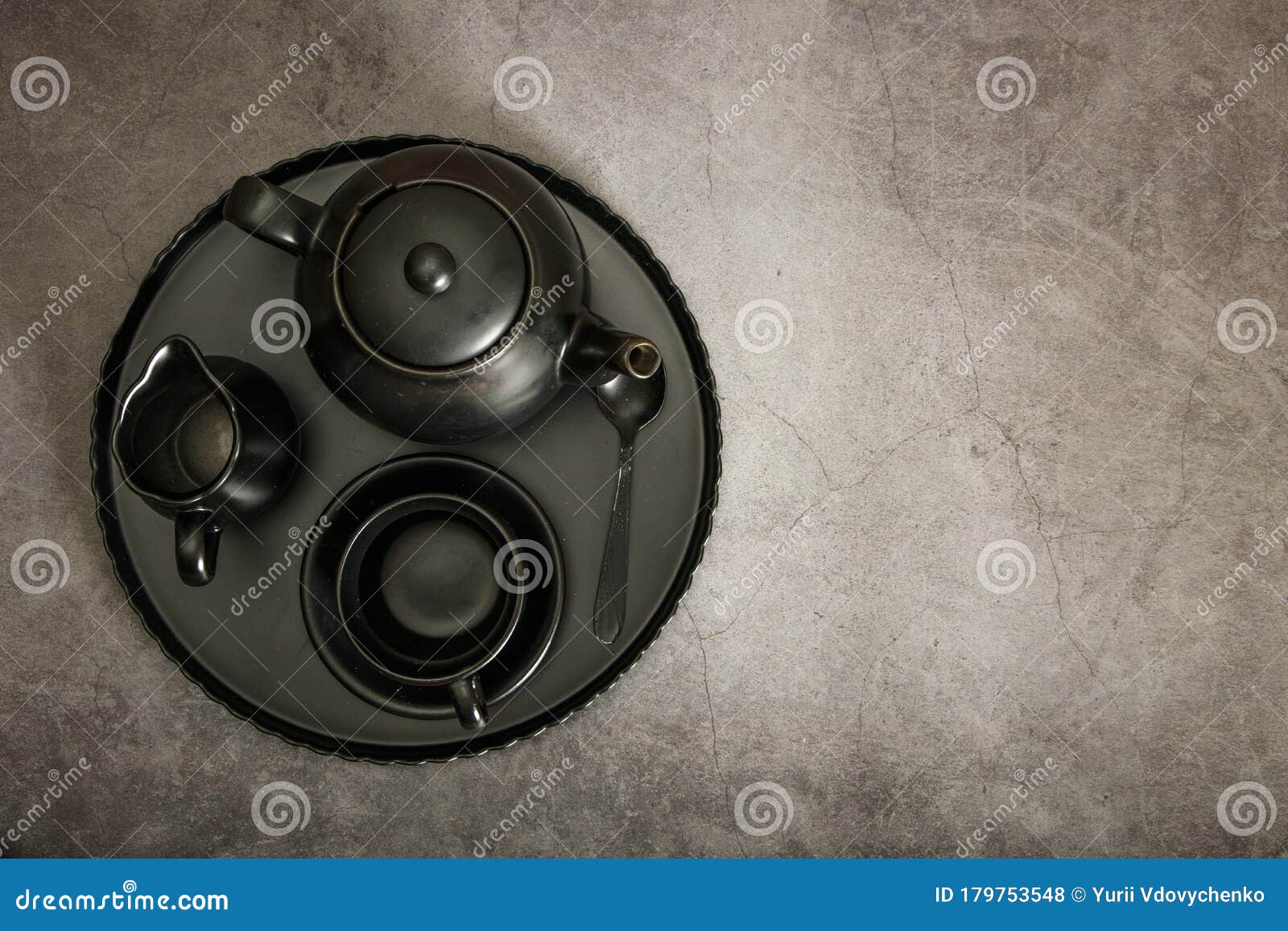 Ceramic Black Dishes with a Set of Cutlery. Empty Black Dishes for