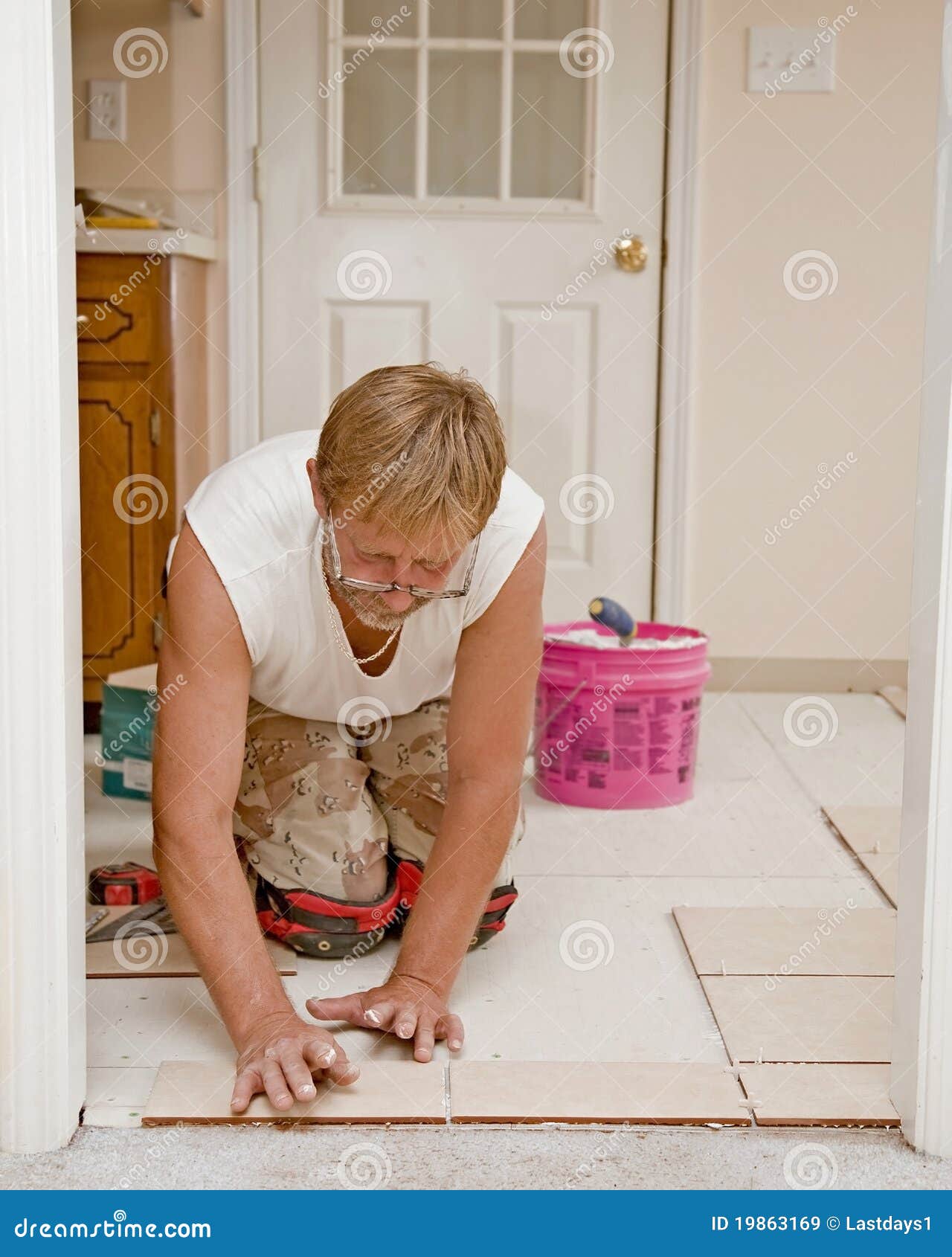 Ceramic Floor Installer stock image. Image of installer 19863169