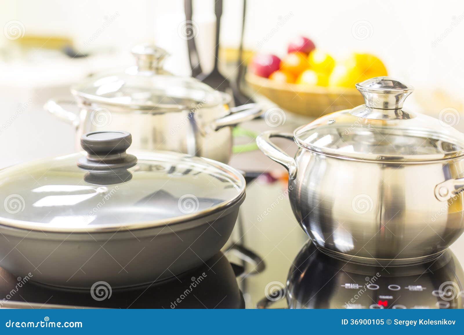 Ceramic hob with pans stock image. Image of steel, citrus 36900105