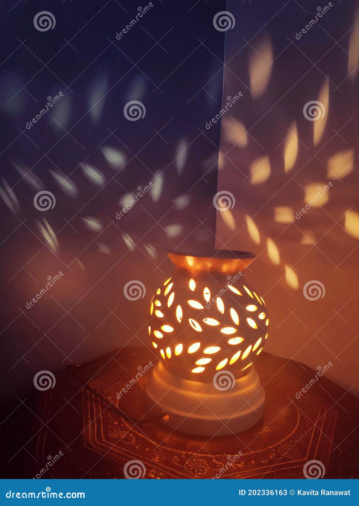 The Ceramic Lamp with Holes Casting Spotty Light Pattern and Shadow on