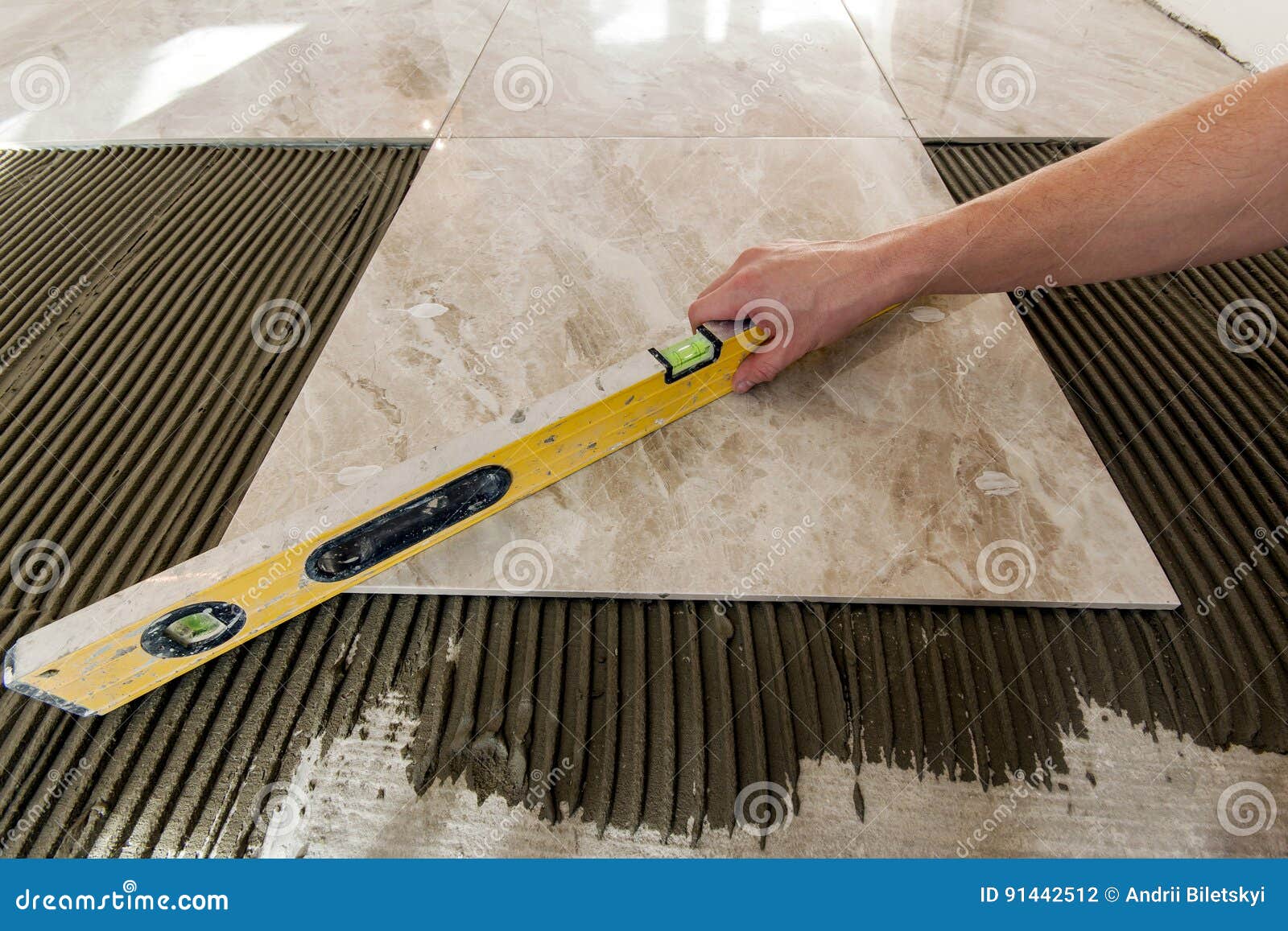 ceramic tiles and tools for tiler. floor tiles installation. home improvement, renovation - ceramic tile floor