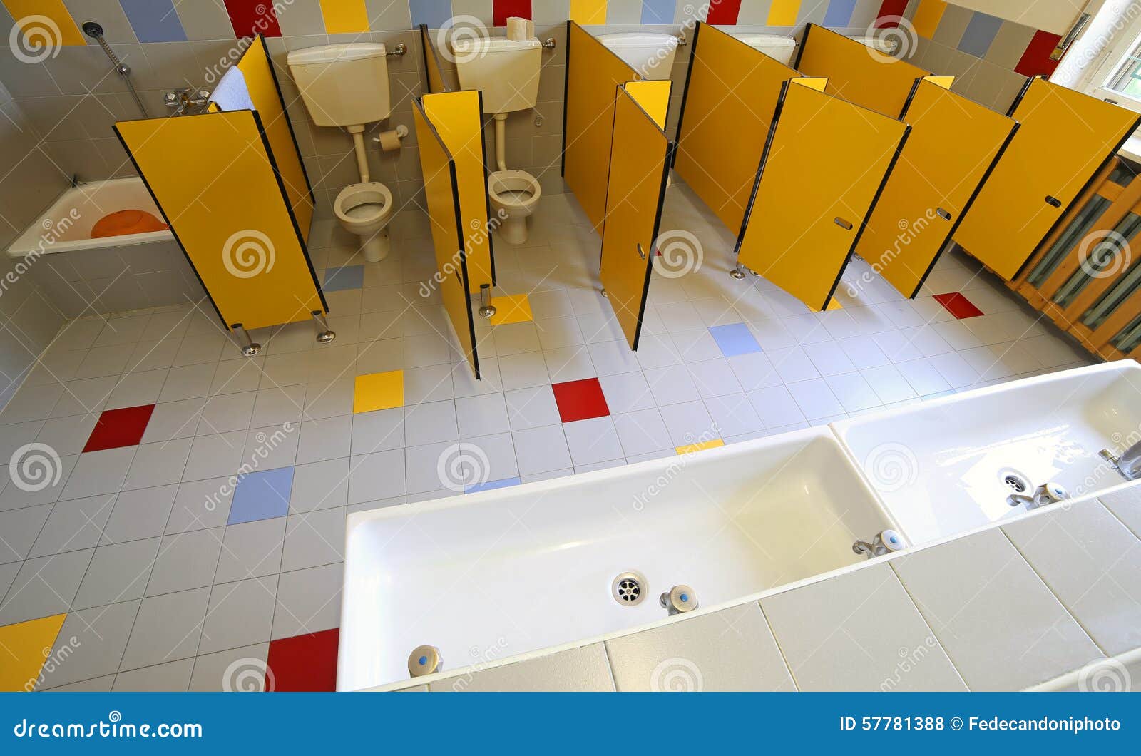 Ceramic Toilets and Sinks in the Bathroom of the Kindergarten Stock