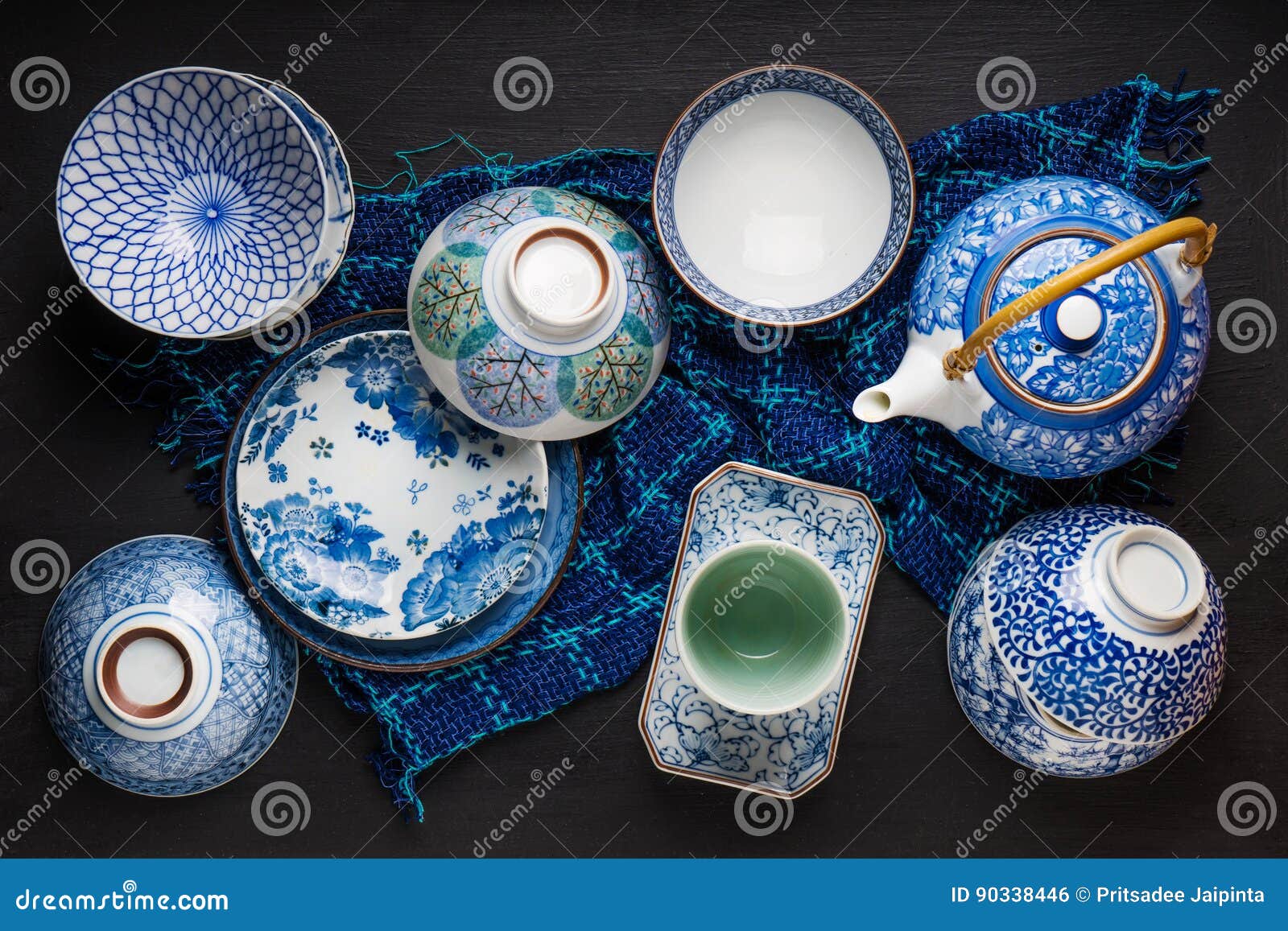 Ceramic Utensils, Bowl Plate and Teapot on Table. Stock Photo Image
