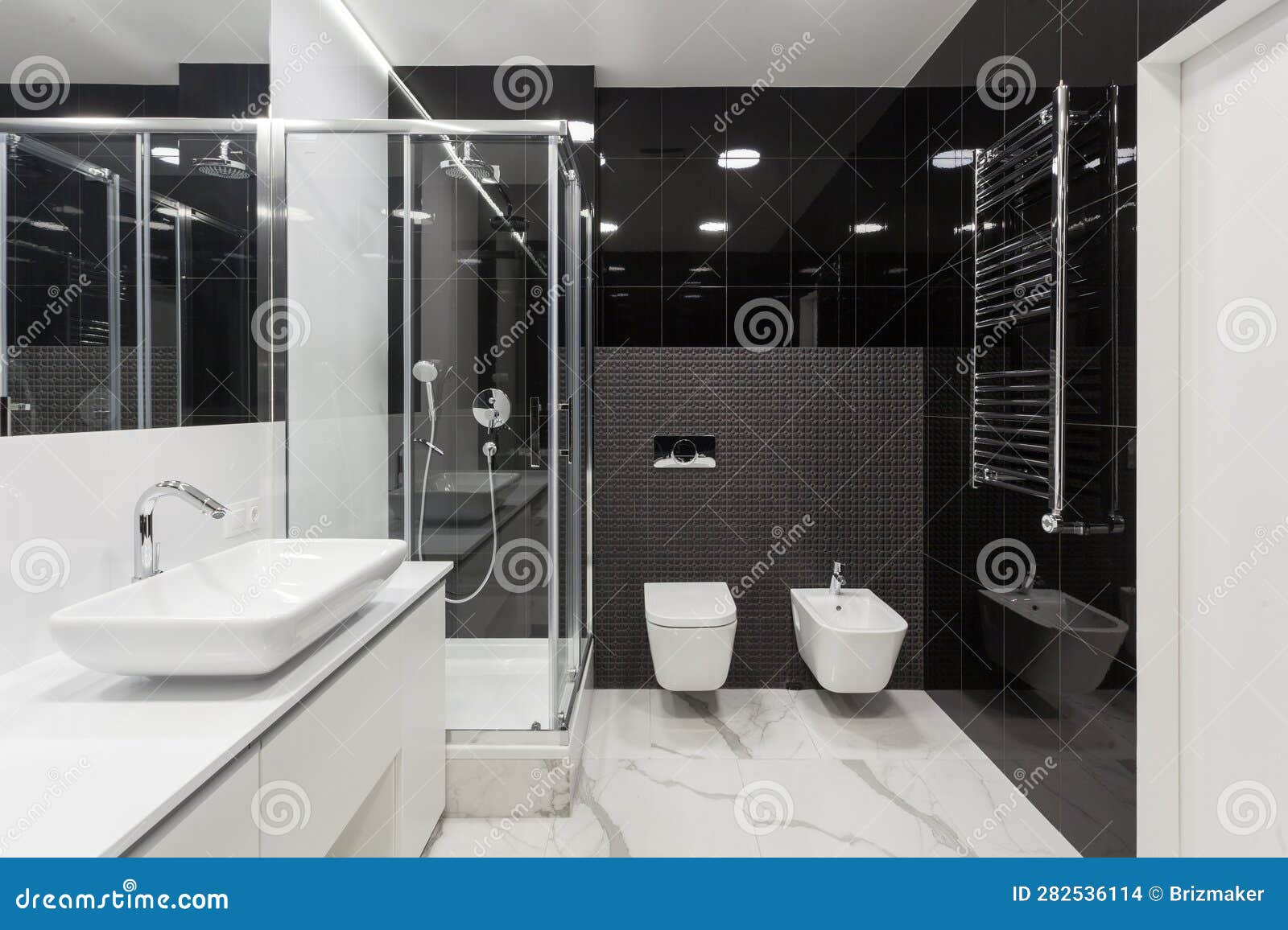 spacious restroom with washbowl, shower cabin and bide