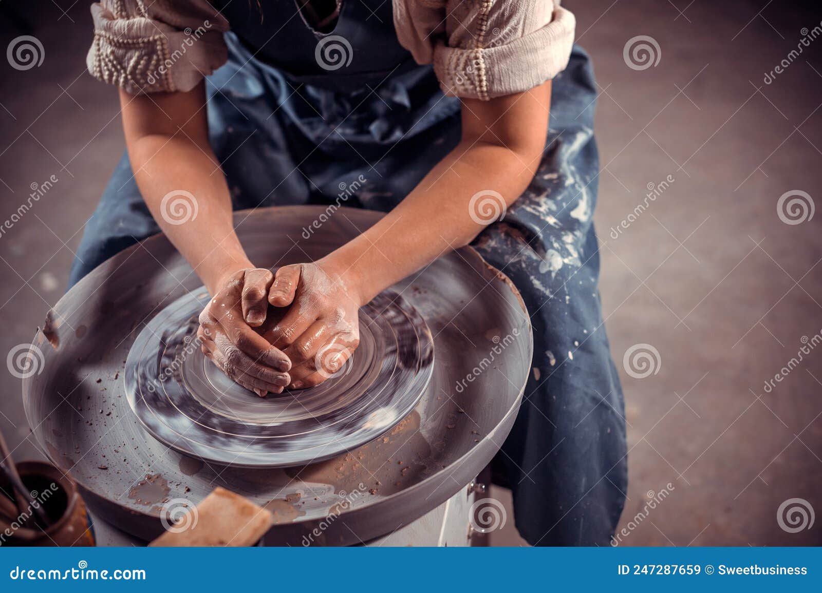 ceramist master making ceramic pot on the pottery wheel . close-up.