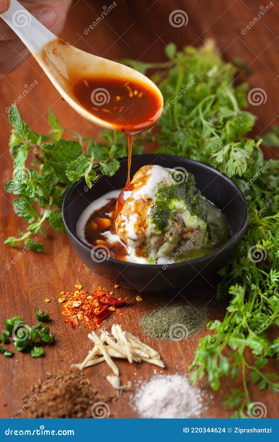 chaat dahi vada aka dahi bhalla, doi bora,  mosaru vade, dahi bara, thayir vadai, perugu vada . prepared by soaking vadas in