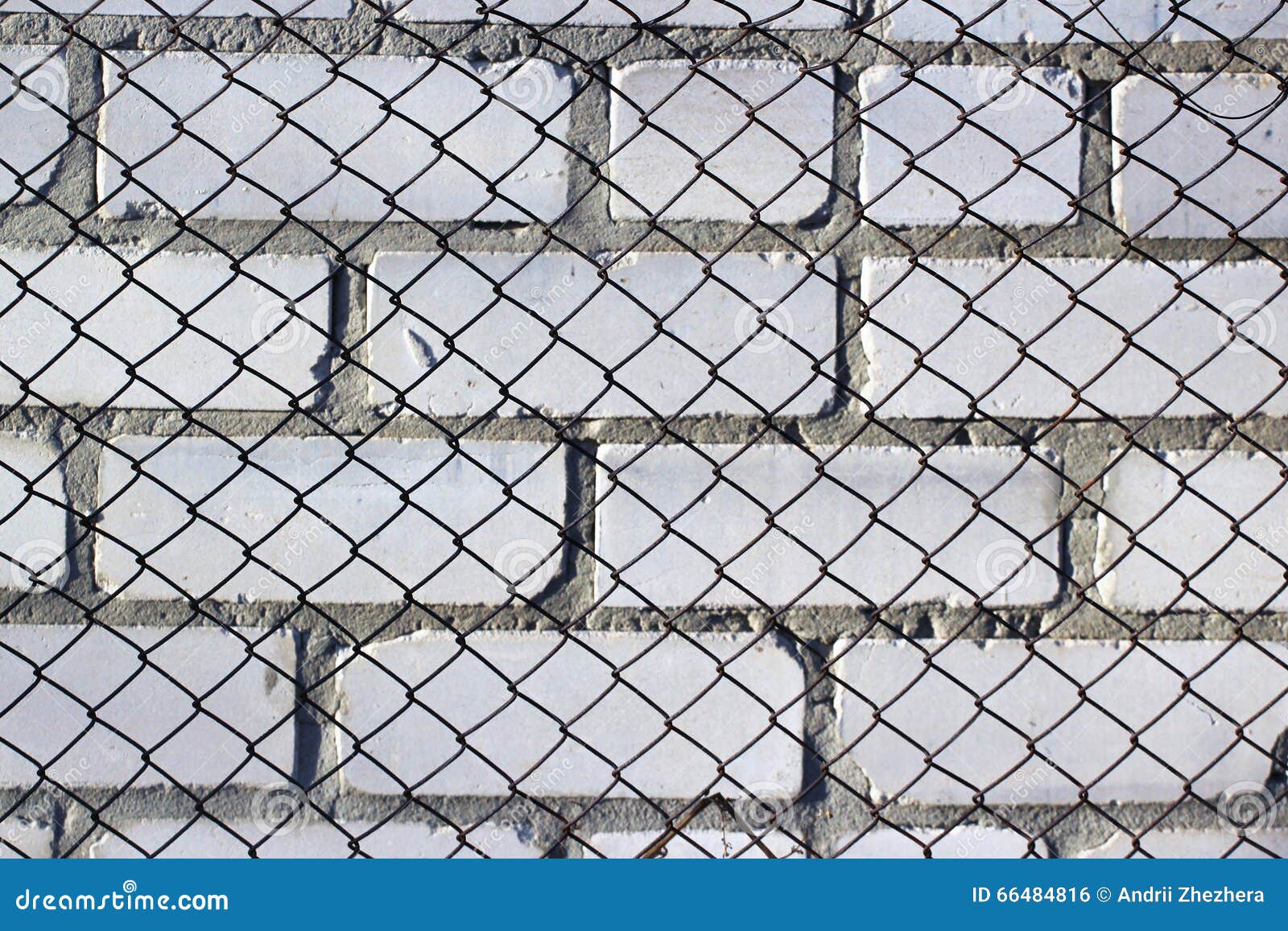 Chain Link Fence on White Brick Wall Stock Photo Image of barrier