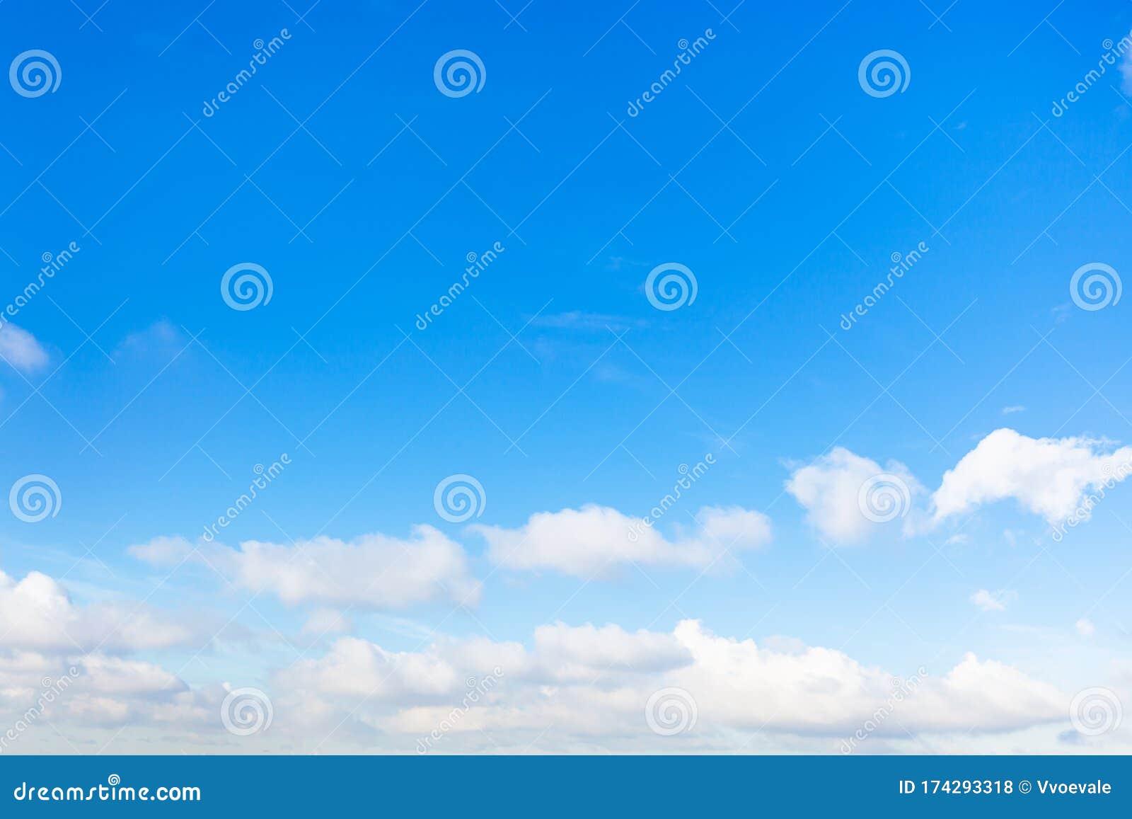 chain of little cumuli clouds in blue sky